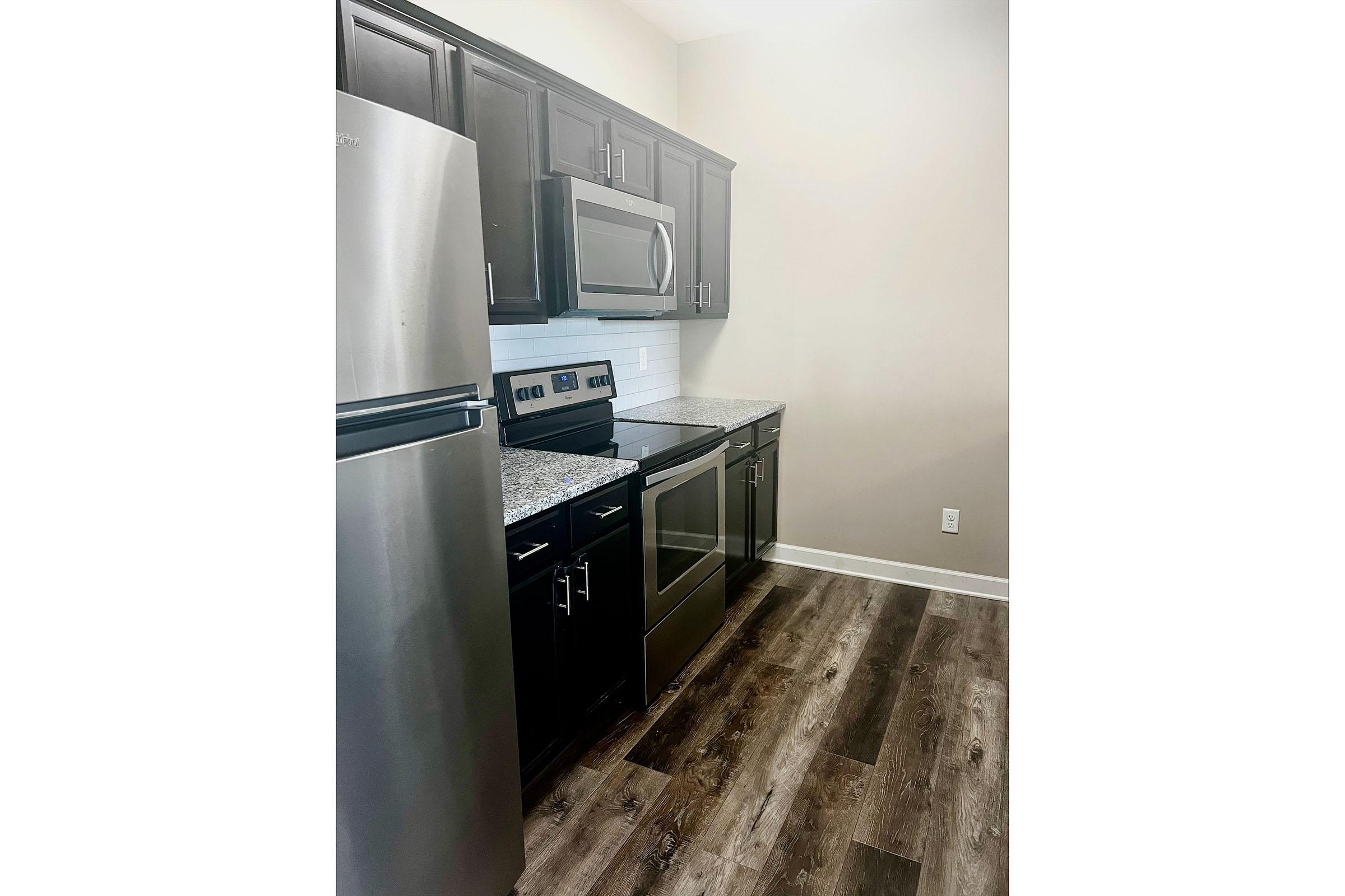 a stainless steel refrigerator in a kitchen