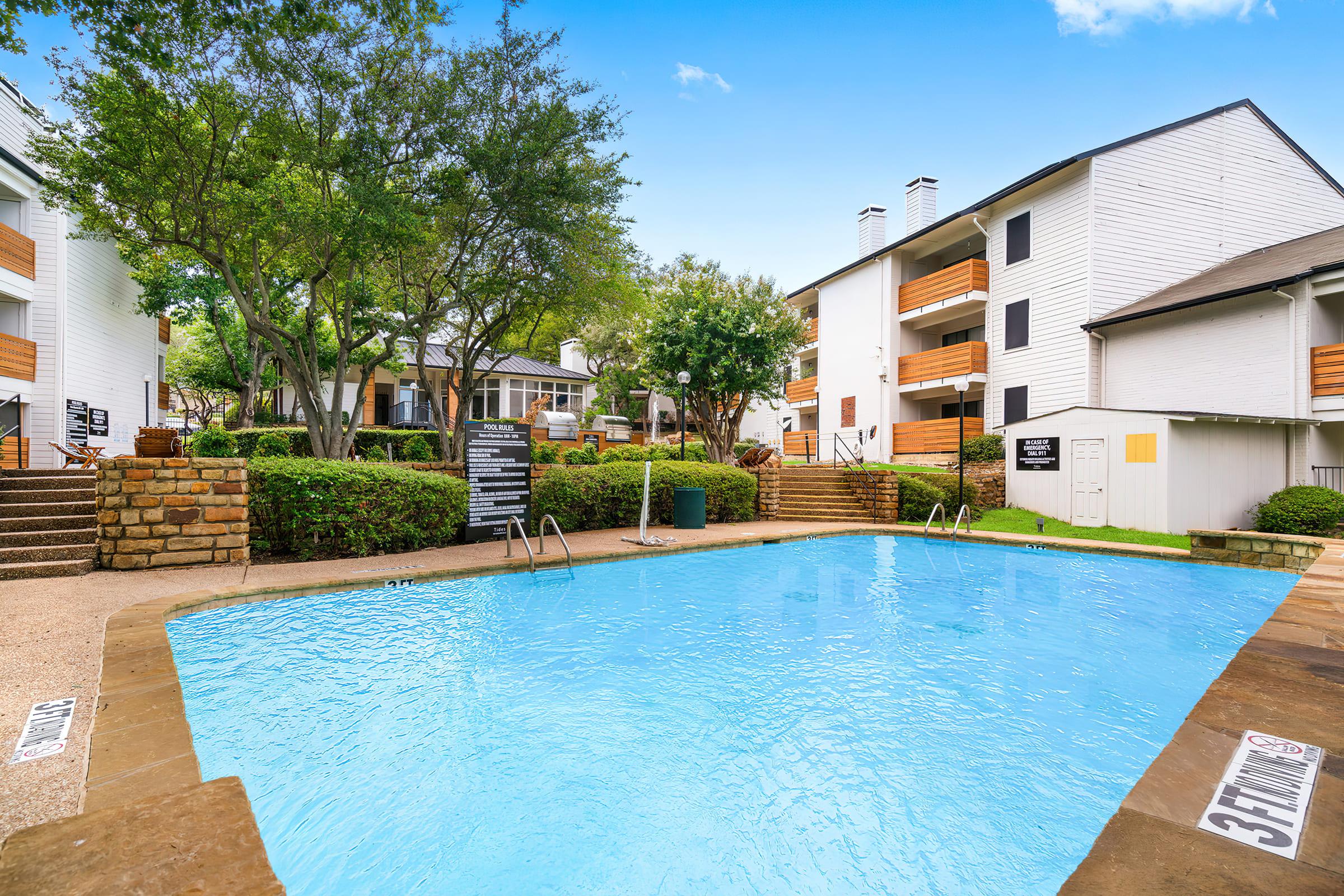 a house with a pool in front of a building