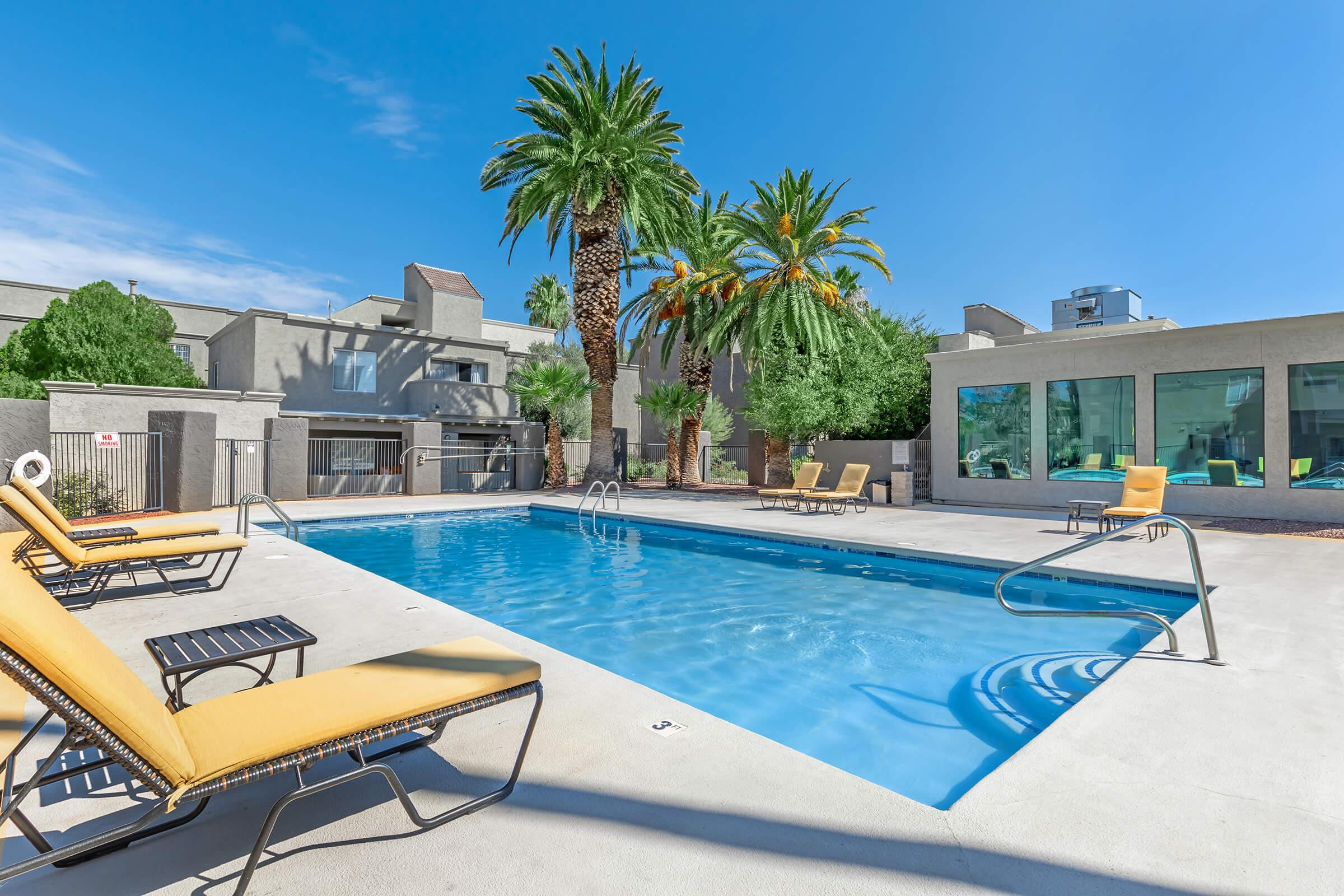 a chair sitting in front of a pool