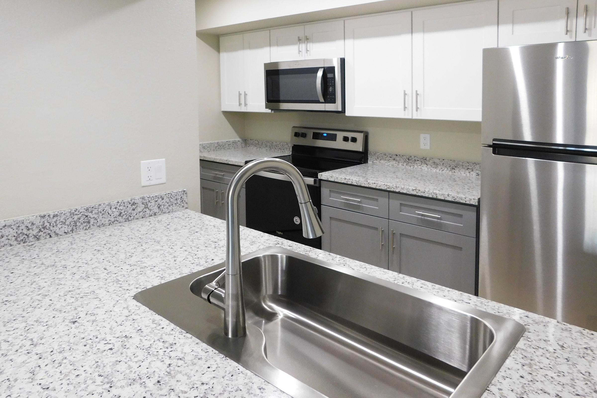 a modern kitchen with stainless steel appliances