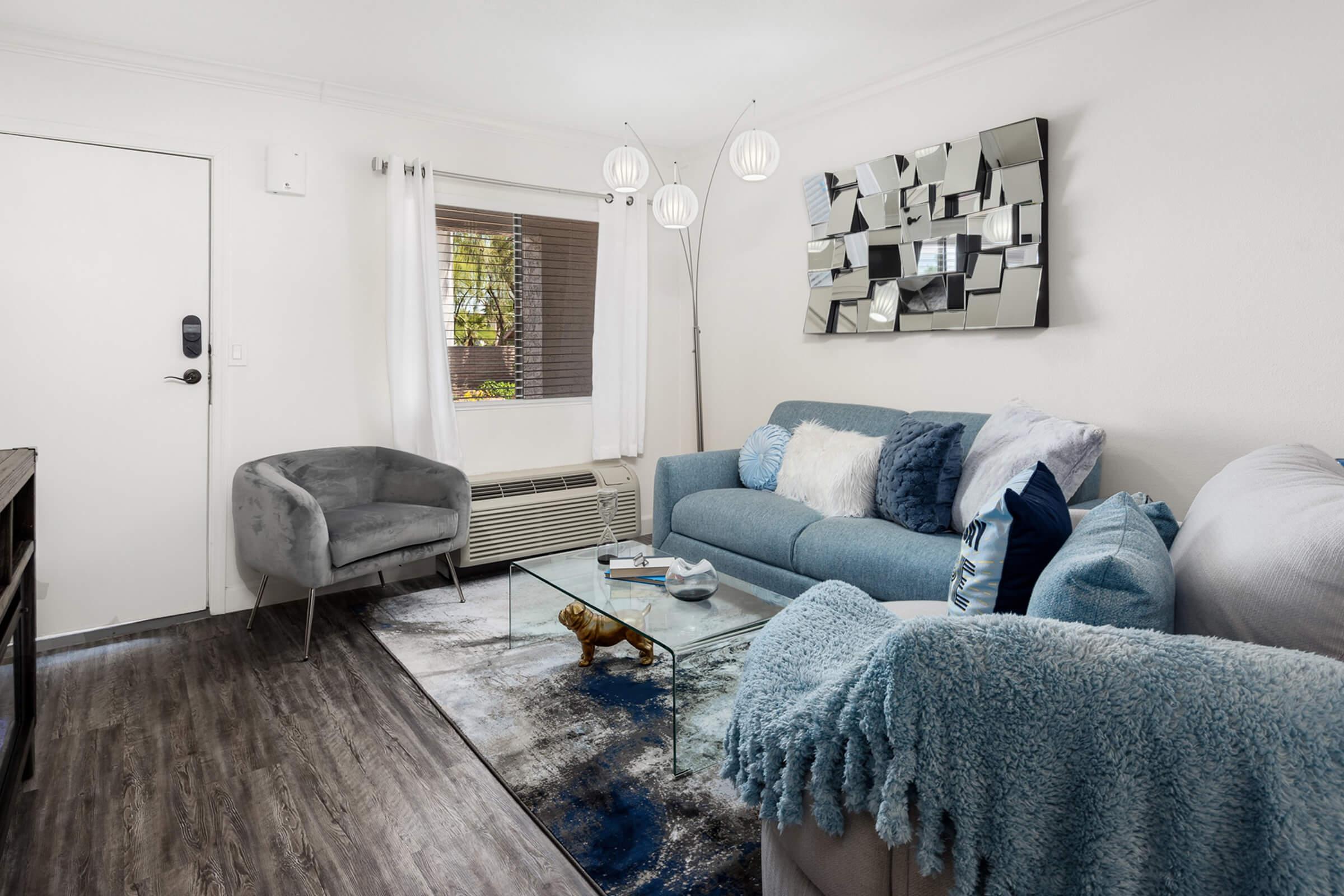 a living room with a bed and a fireplace