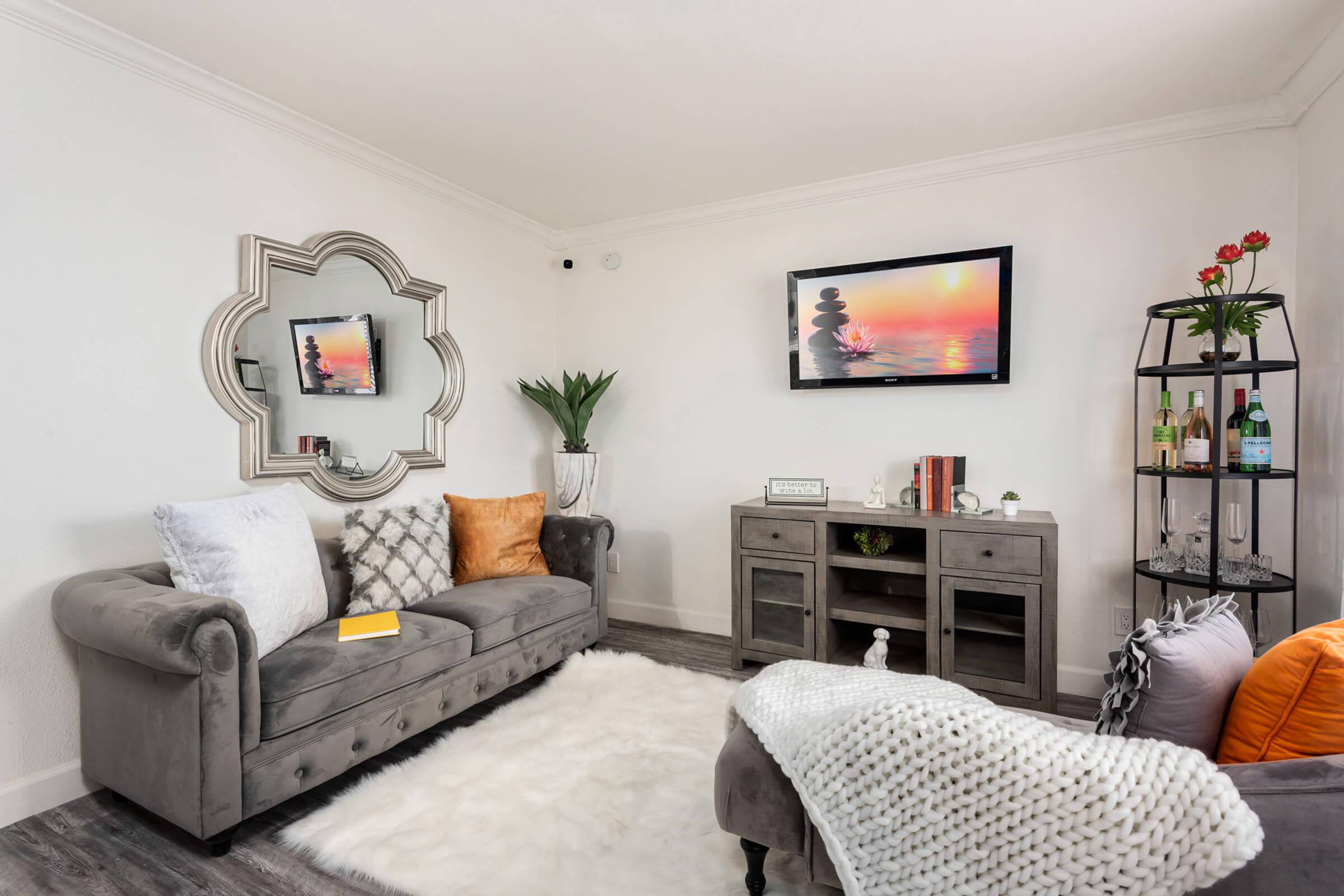 a living room filled with furniture and a fire place