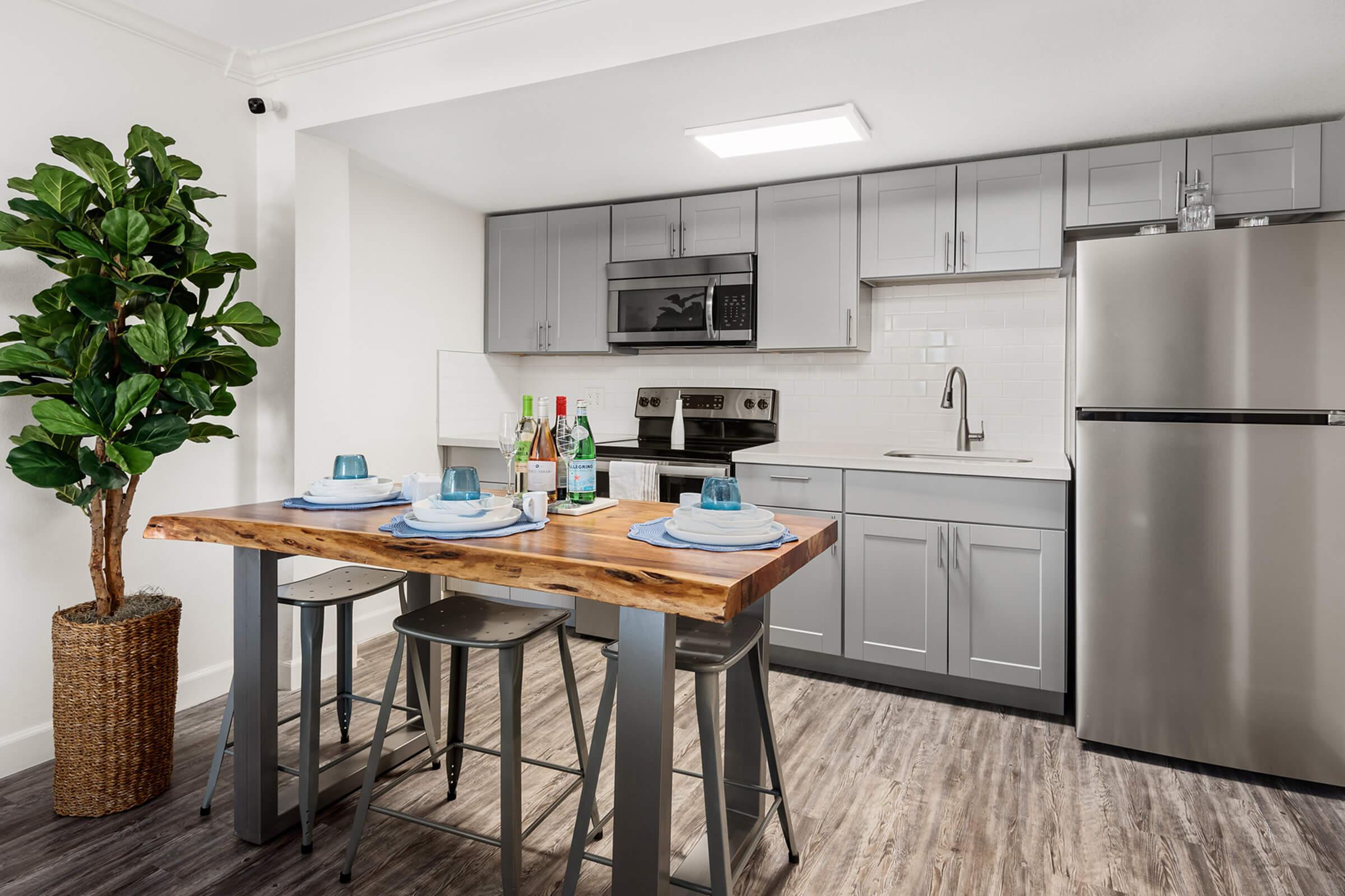 a kitchen with a dining table