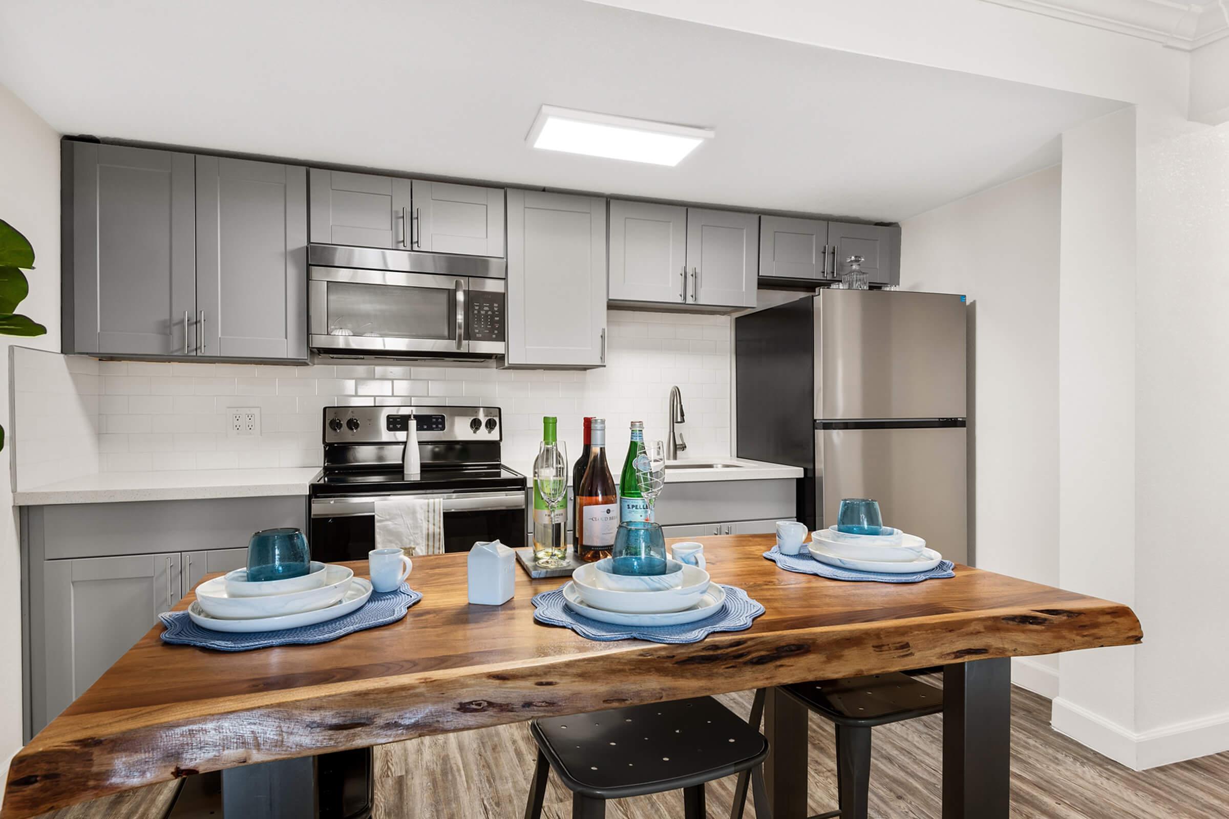 a kitchen with an island in the middle of a table