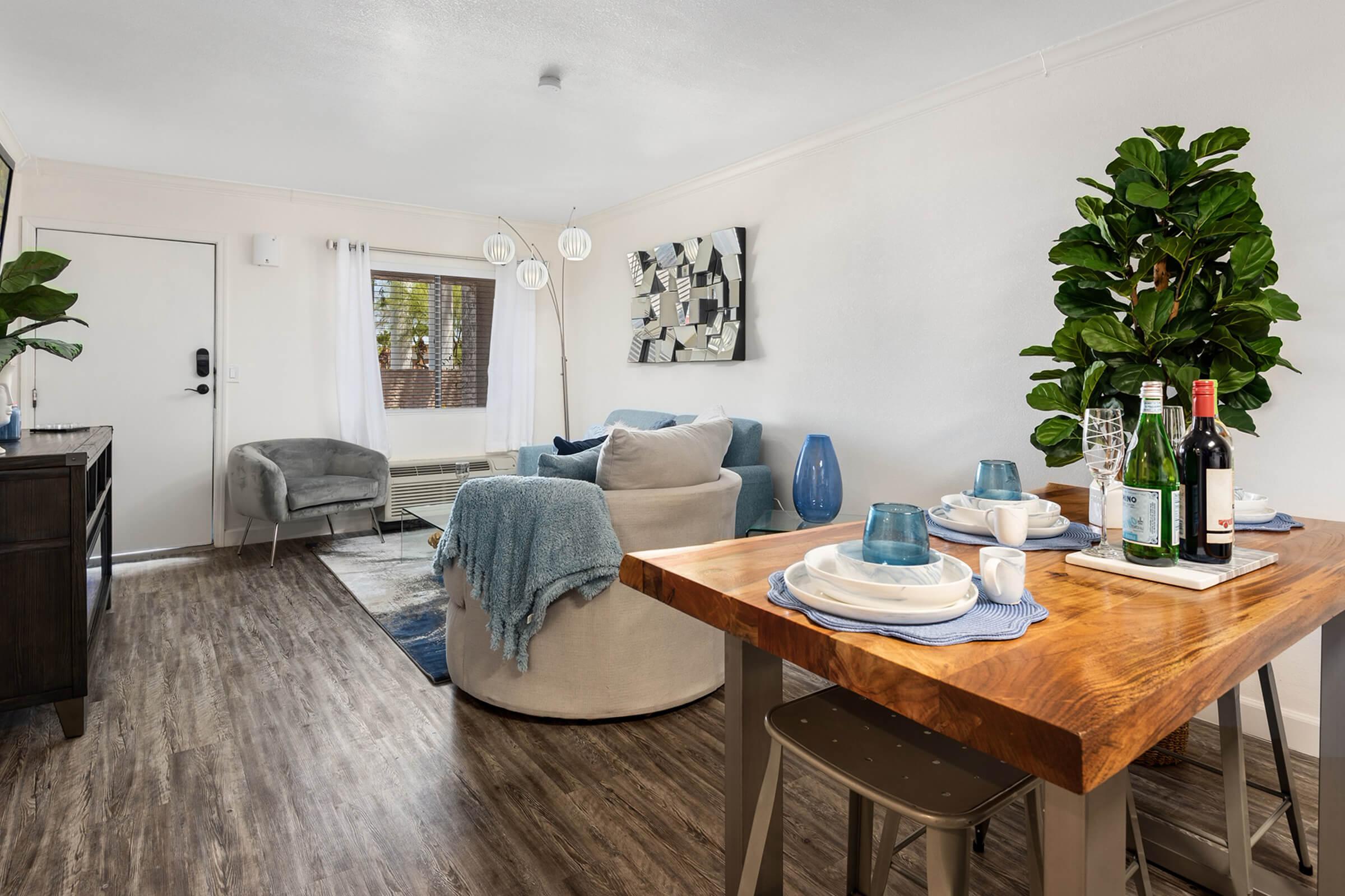 a living room filled with furniture and a table