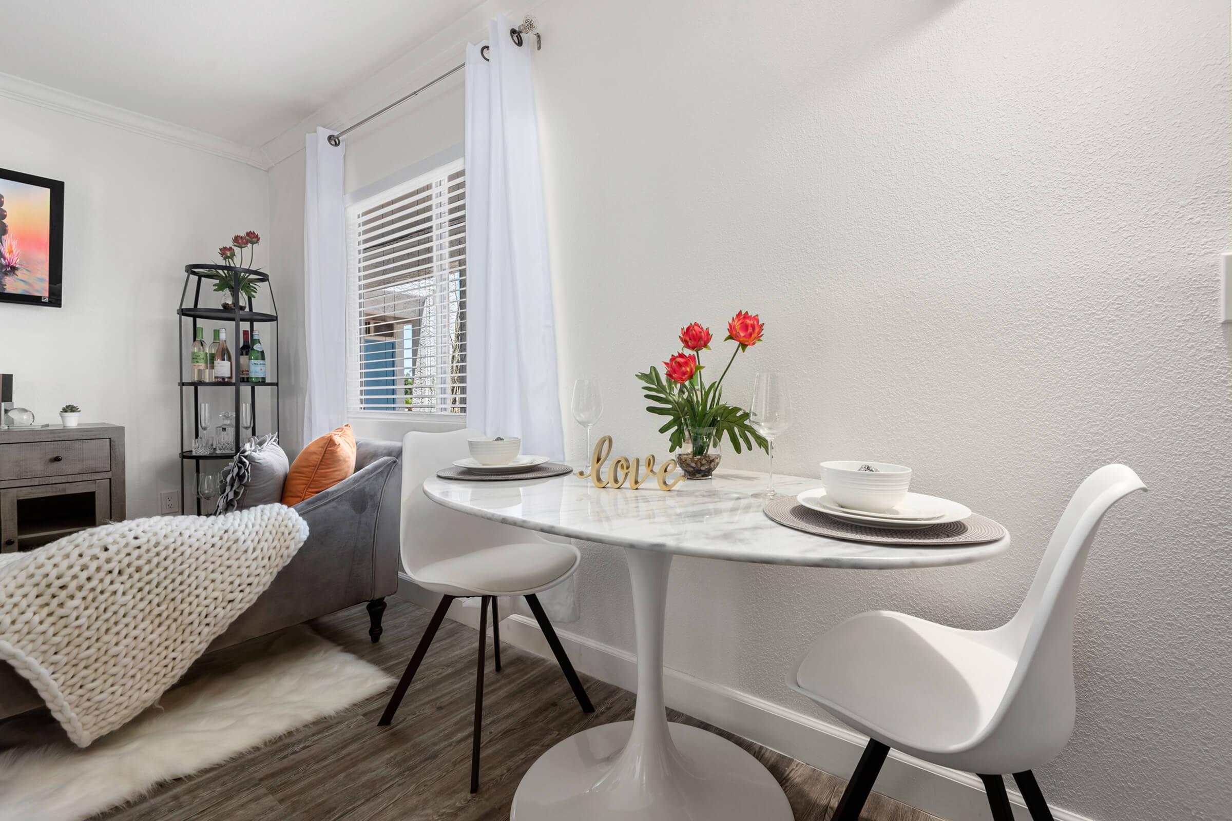 a living room filled with furniture and a window