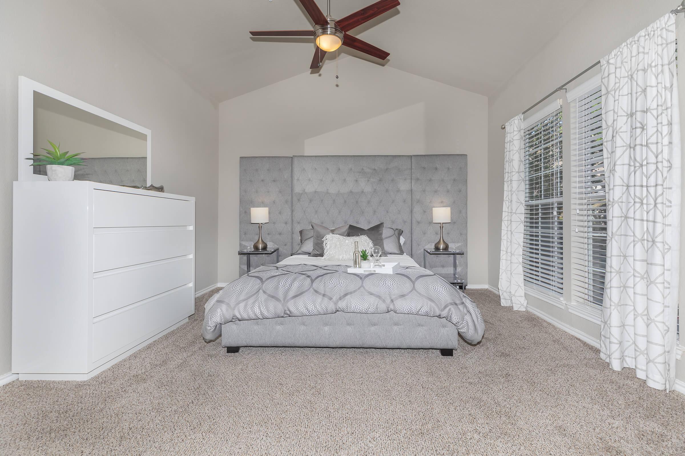 a bedroom with a bed in a room