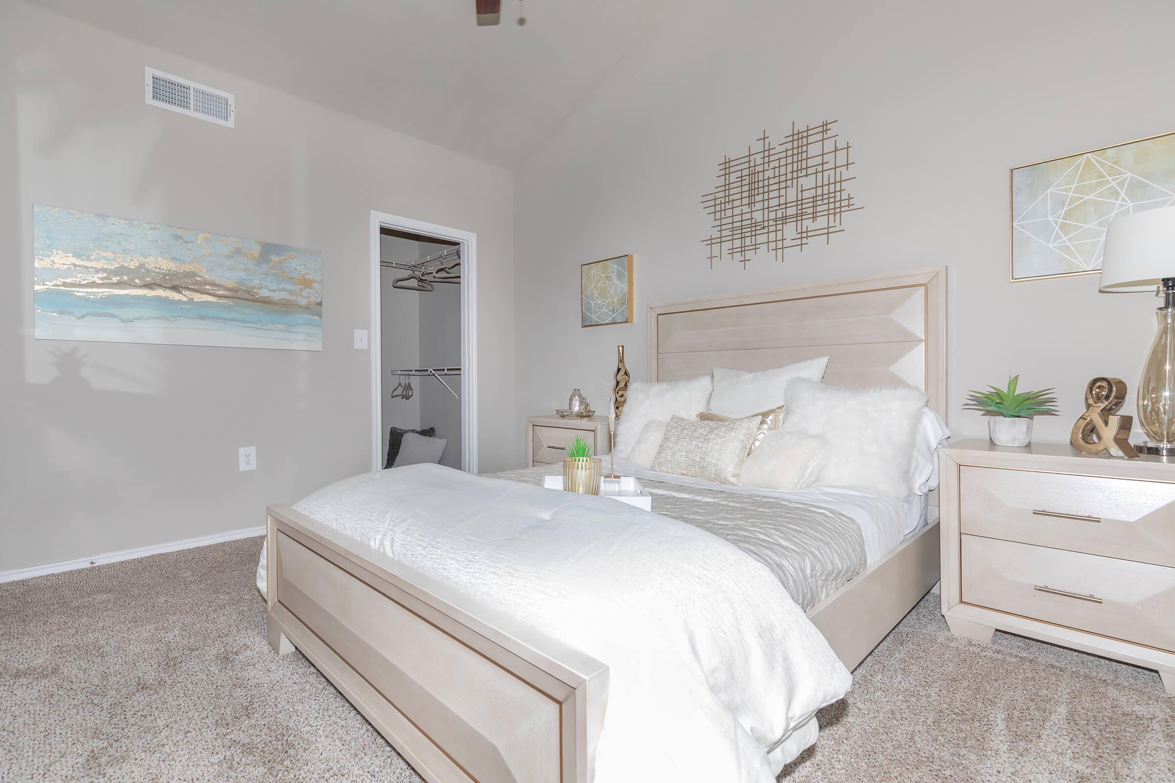 a bedroom with a large bed in a room