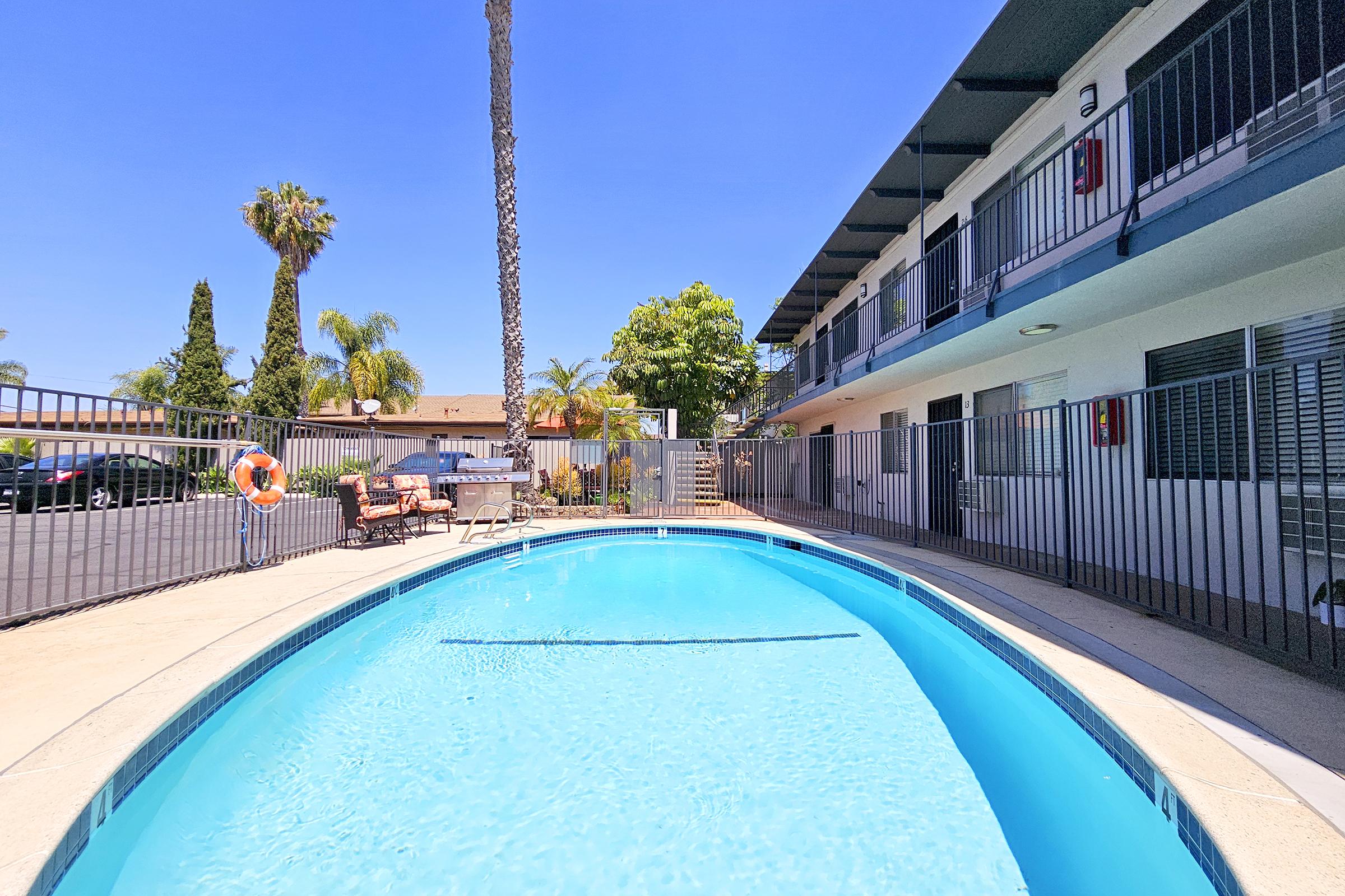 a train is parked on the side of the pool