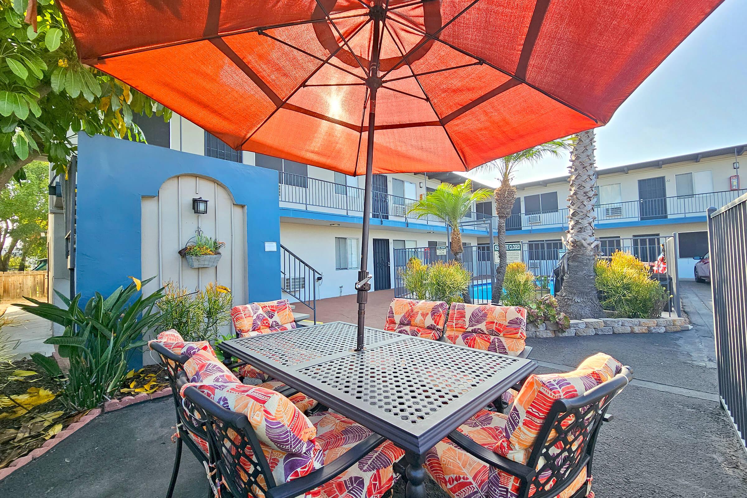 a colorful umbrella sitting on top of a building