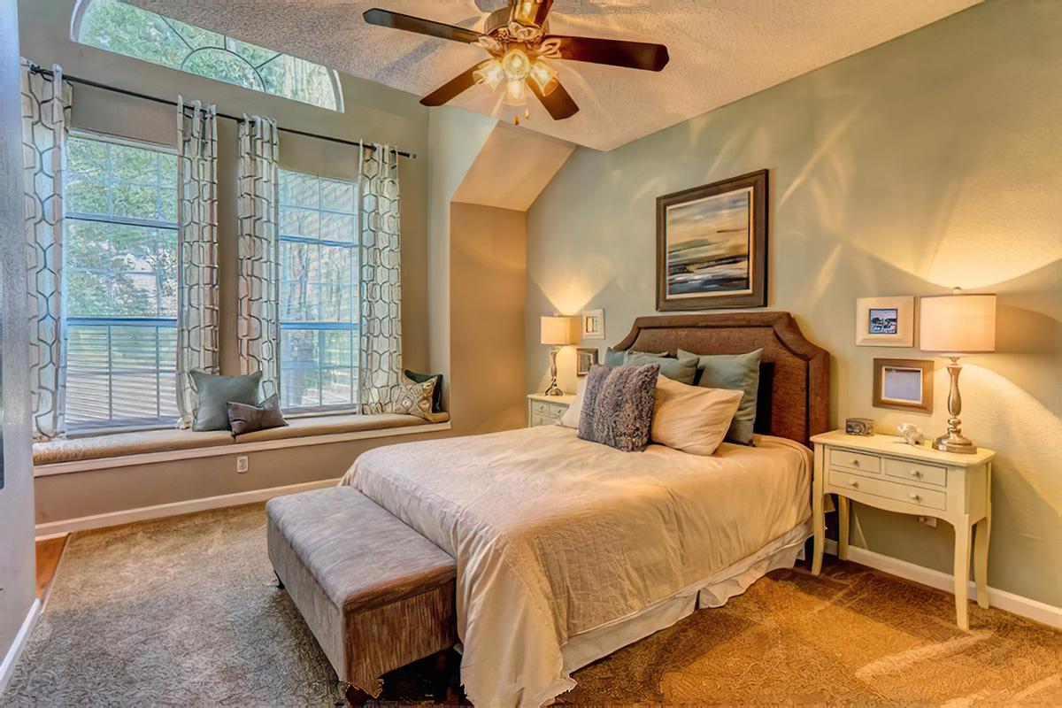 a bedroom with a large bed in a room