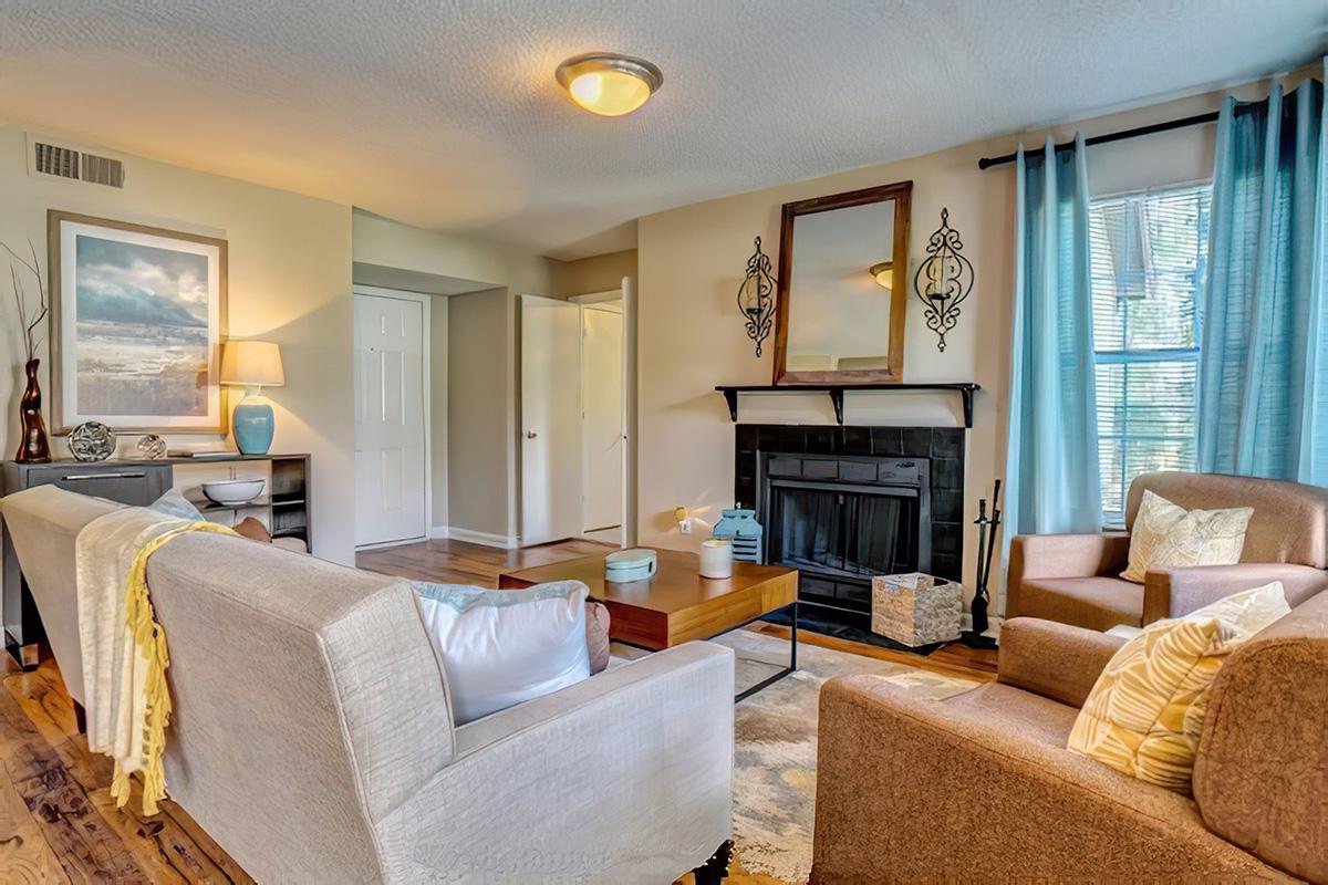 a hotel room filled with furniture and a large window