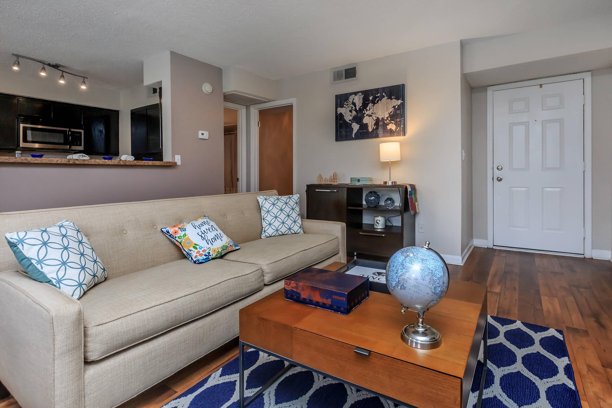 a living room filled with furniture and a fireplace