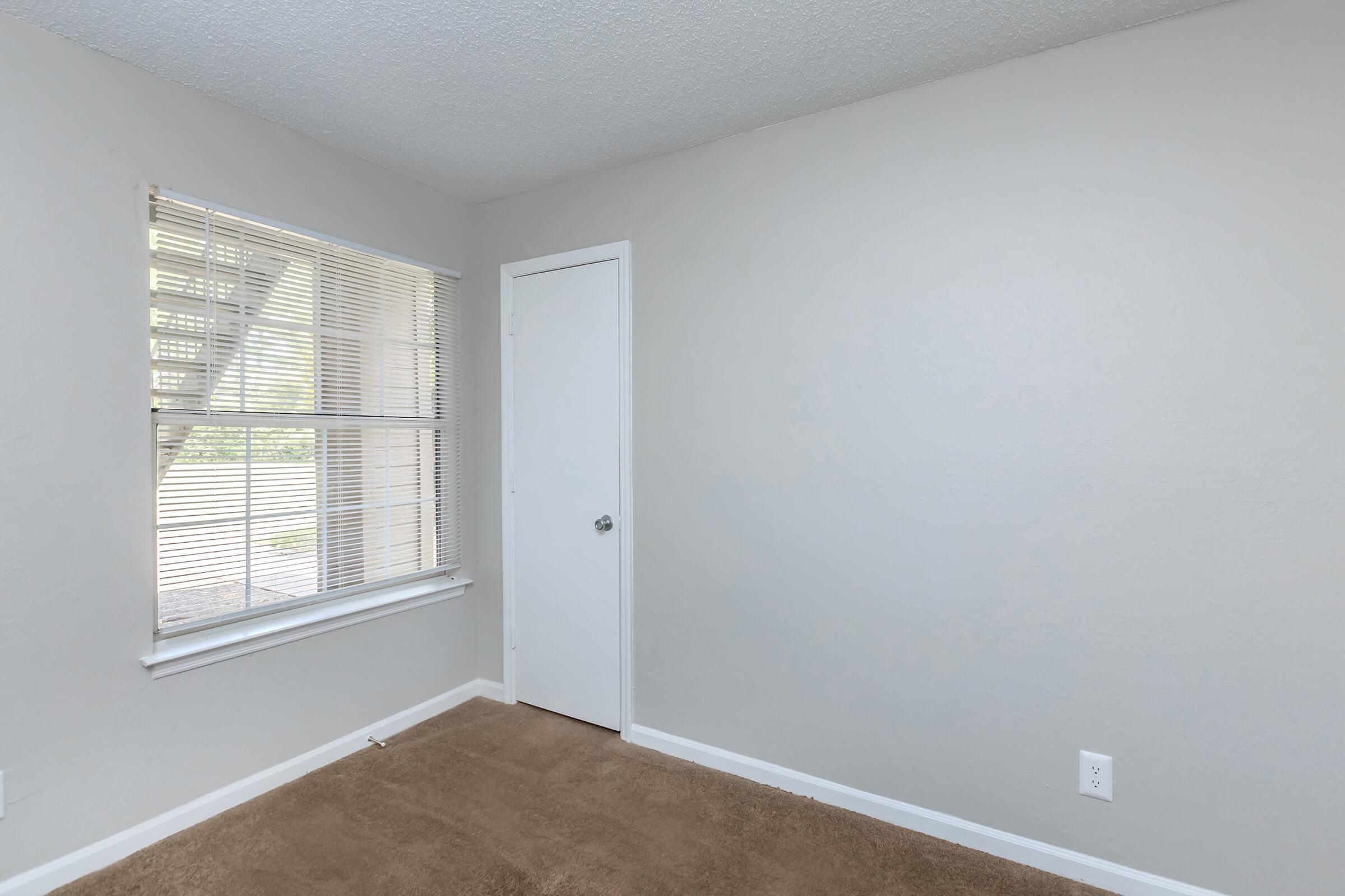 a room with a sink and a window