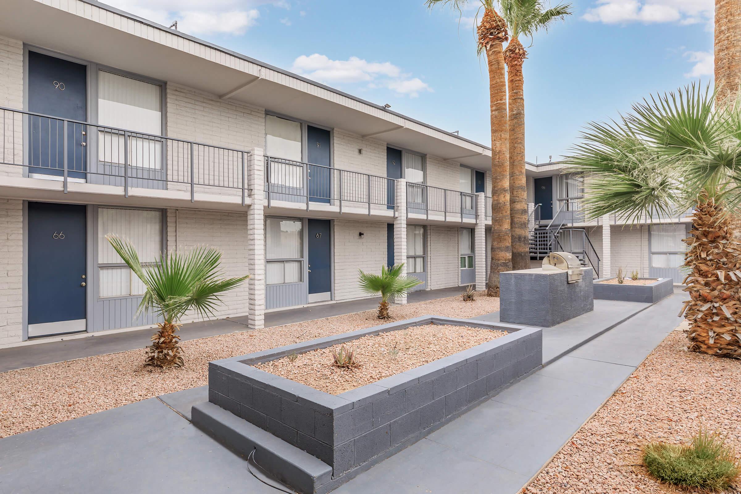 a palm tree in front of a building