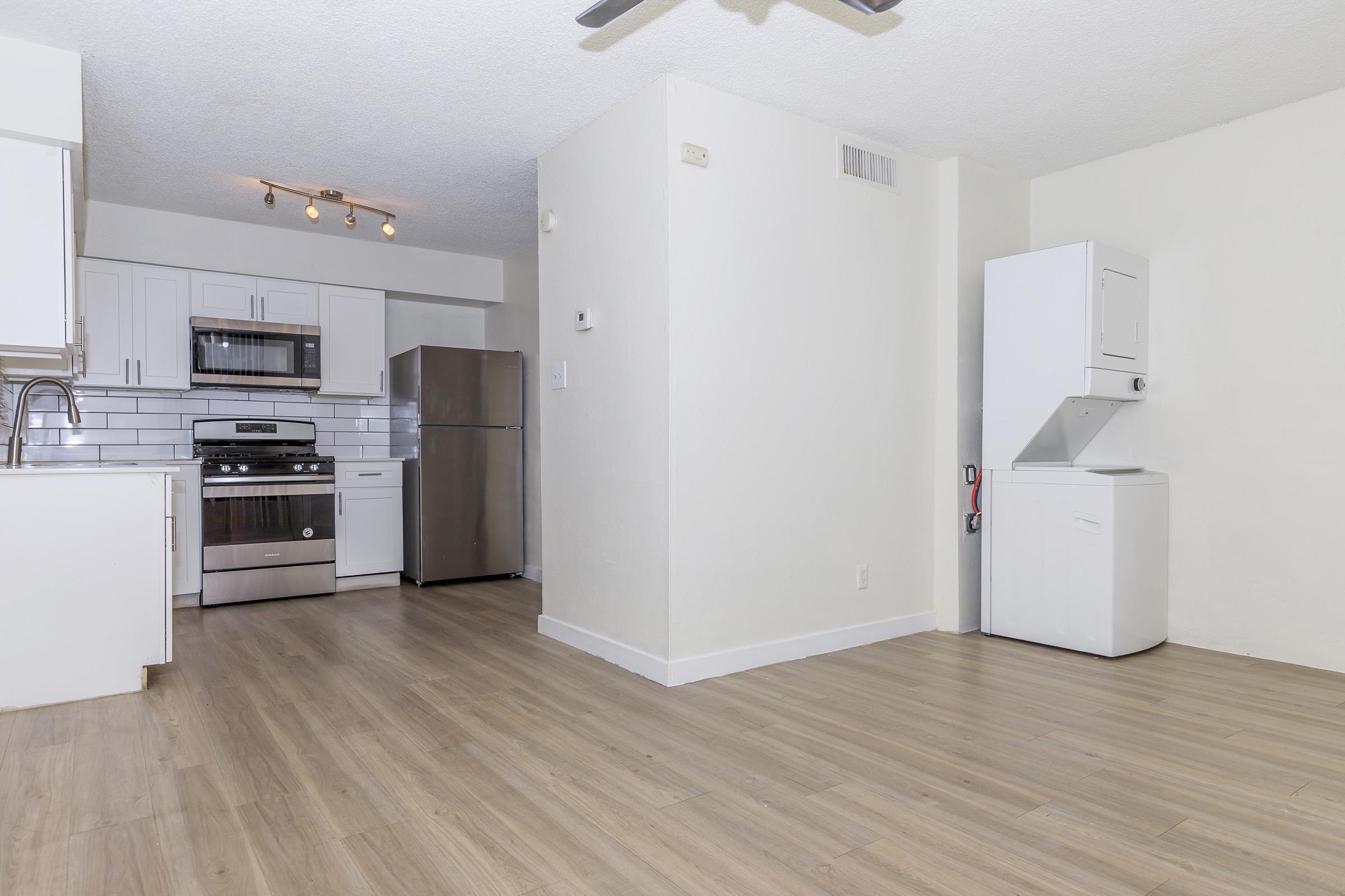 a kitchen with a wood floor