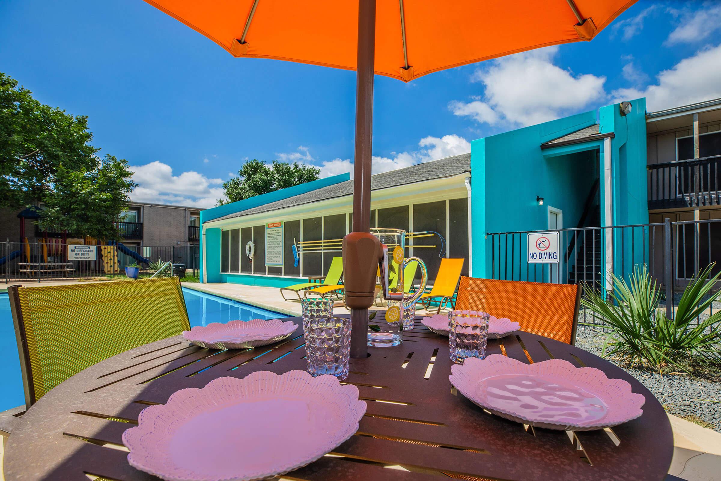 a table topped with a blue umbrella