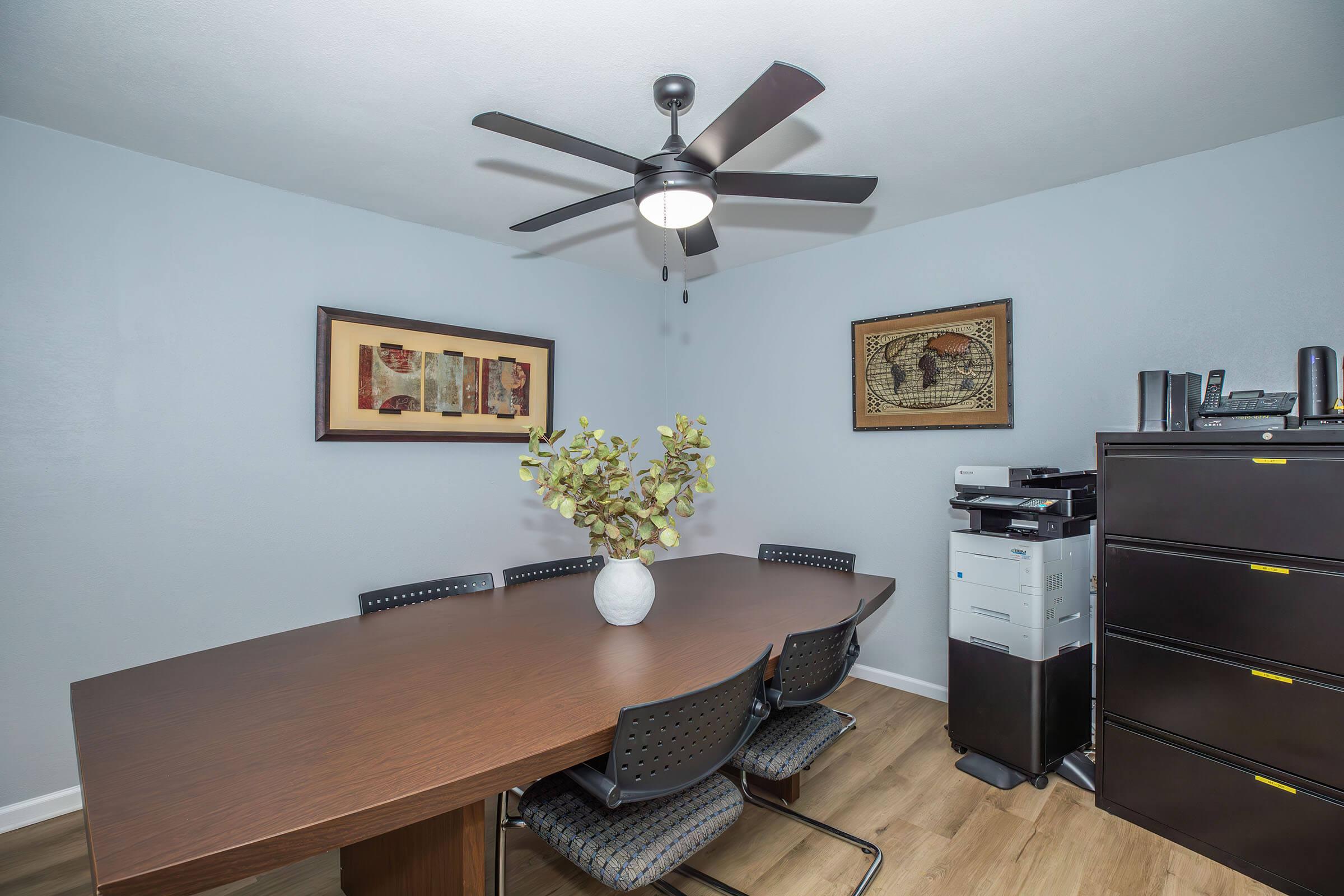 a desk with a chair in a room