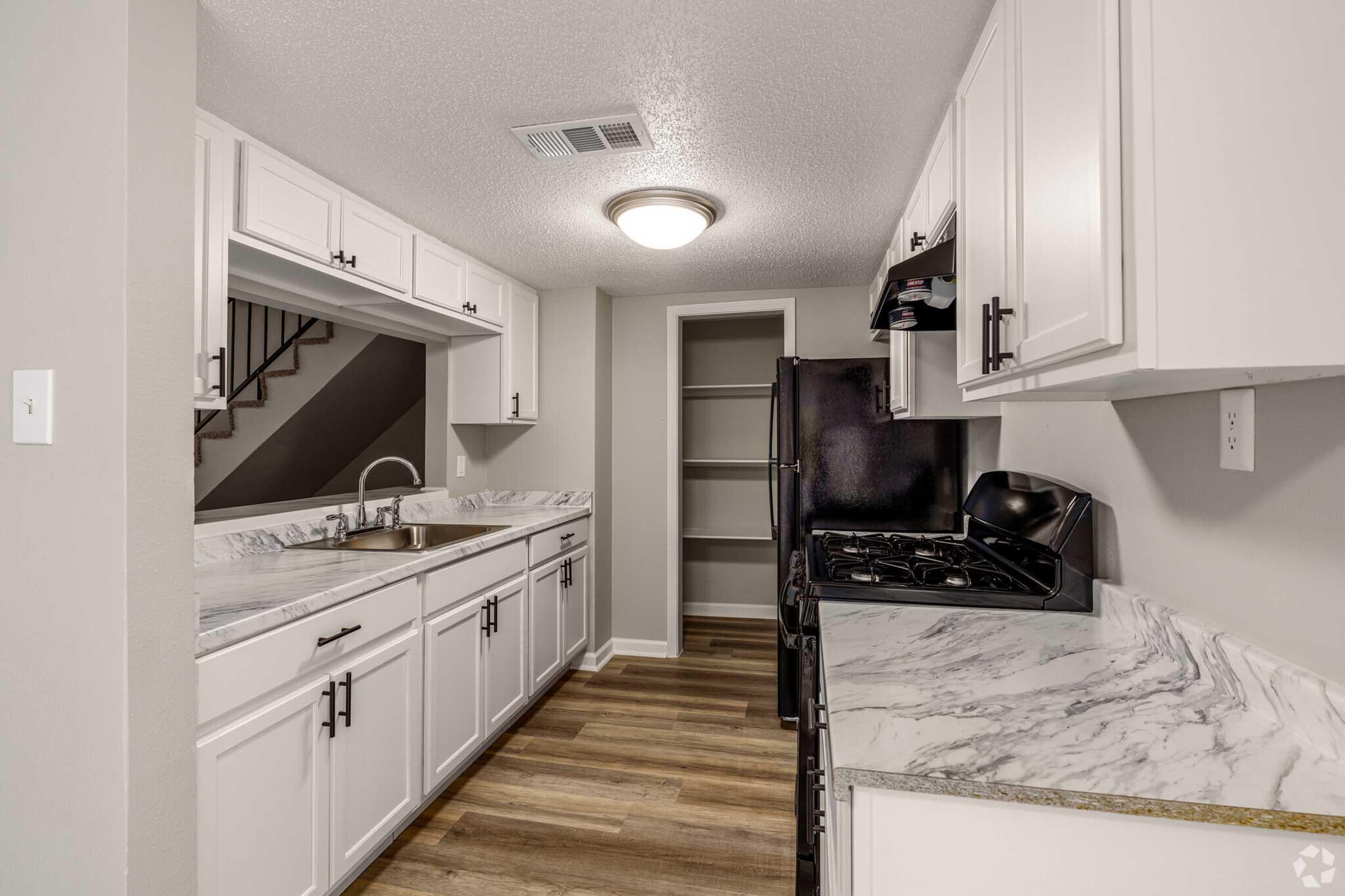 a kitchen with a large bed in a room