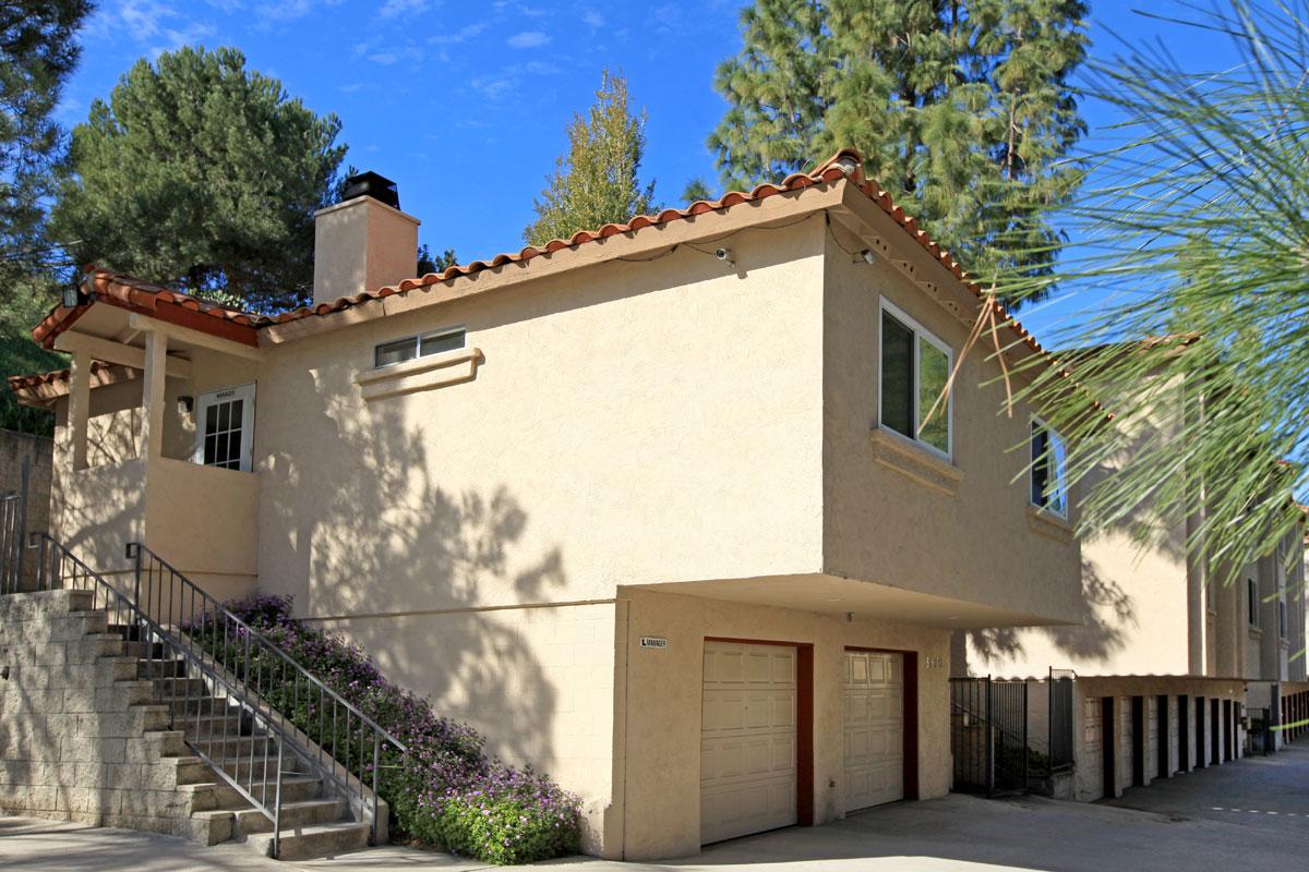 a house with trees in the background