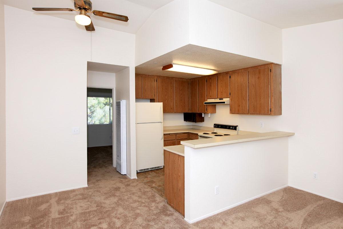 a white refrigerator freezer sitting inside of a kitchen