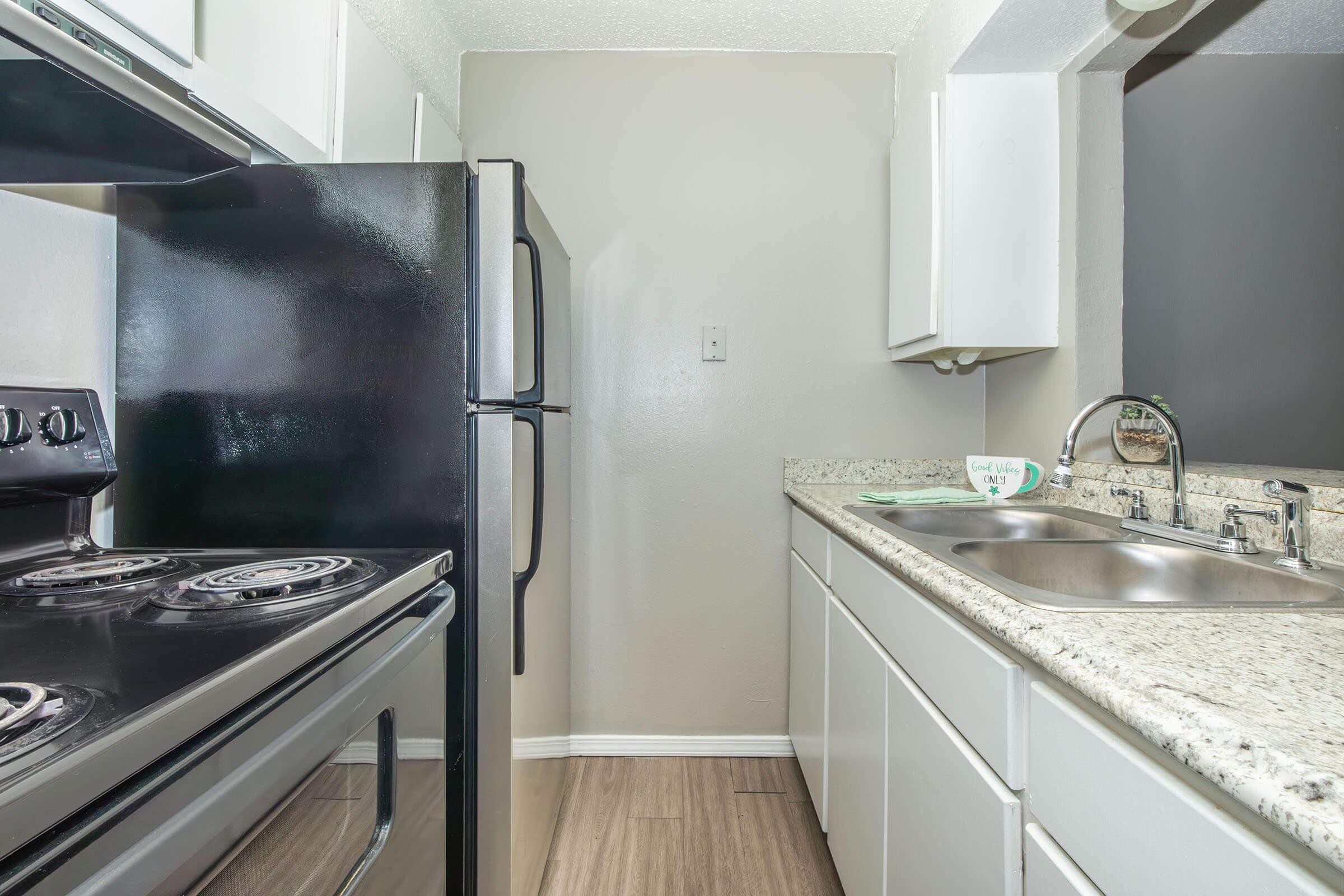 a large kitchen with stainless steel appliances