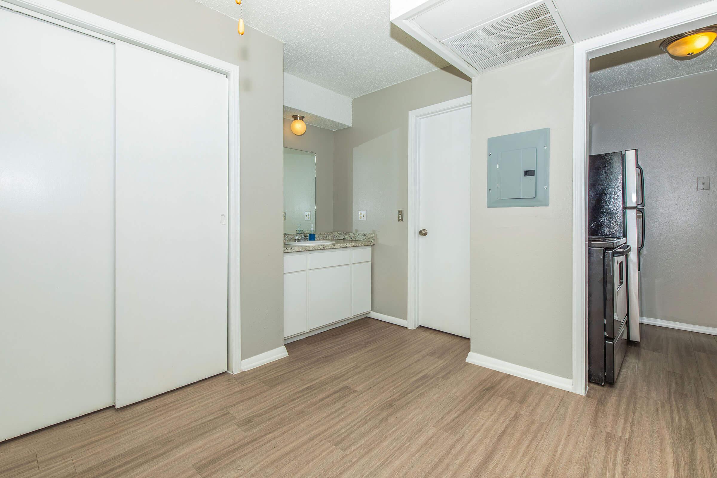 a kitchen with a sink and a refrigerator