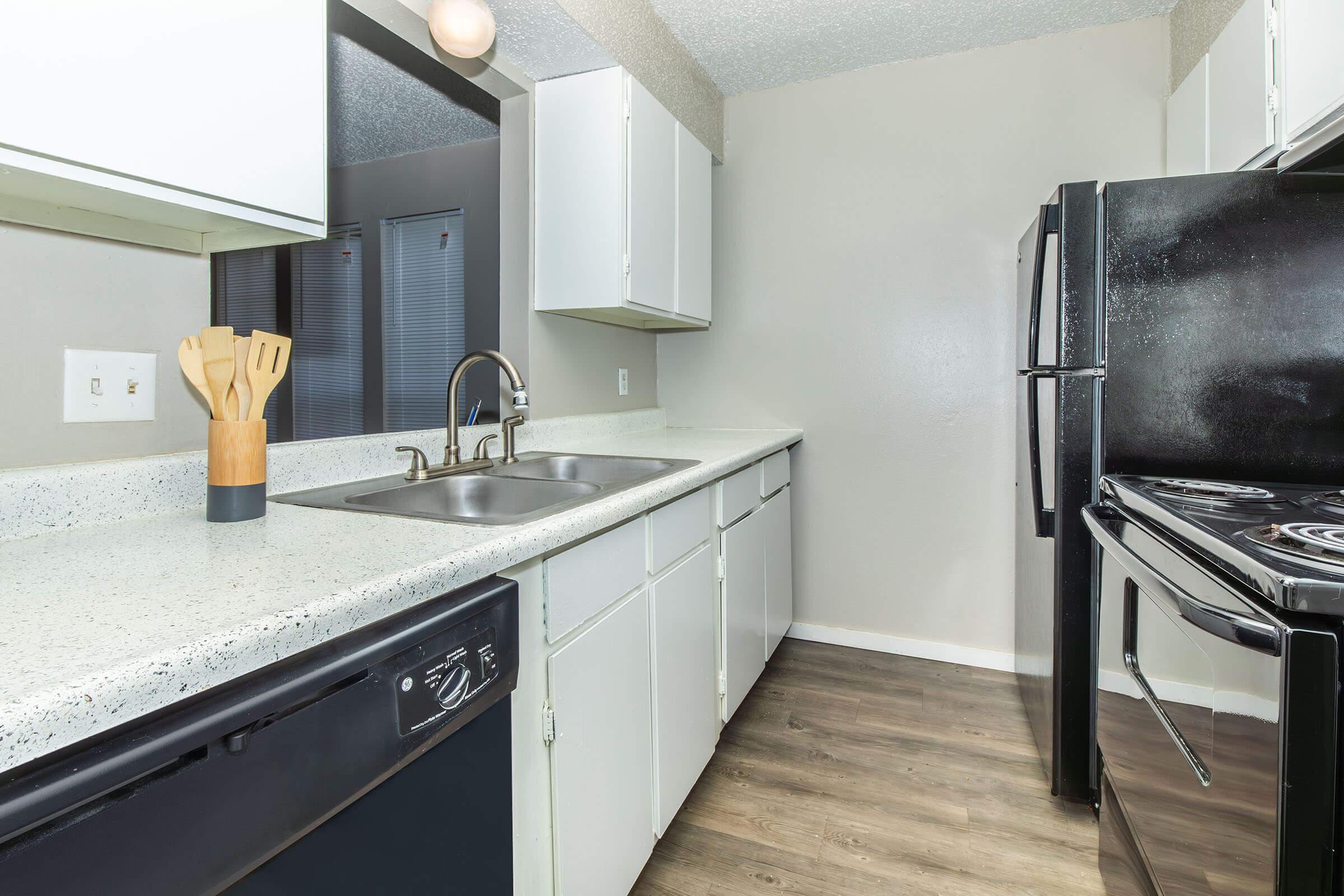 a large kitchen with stainless steel appliances