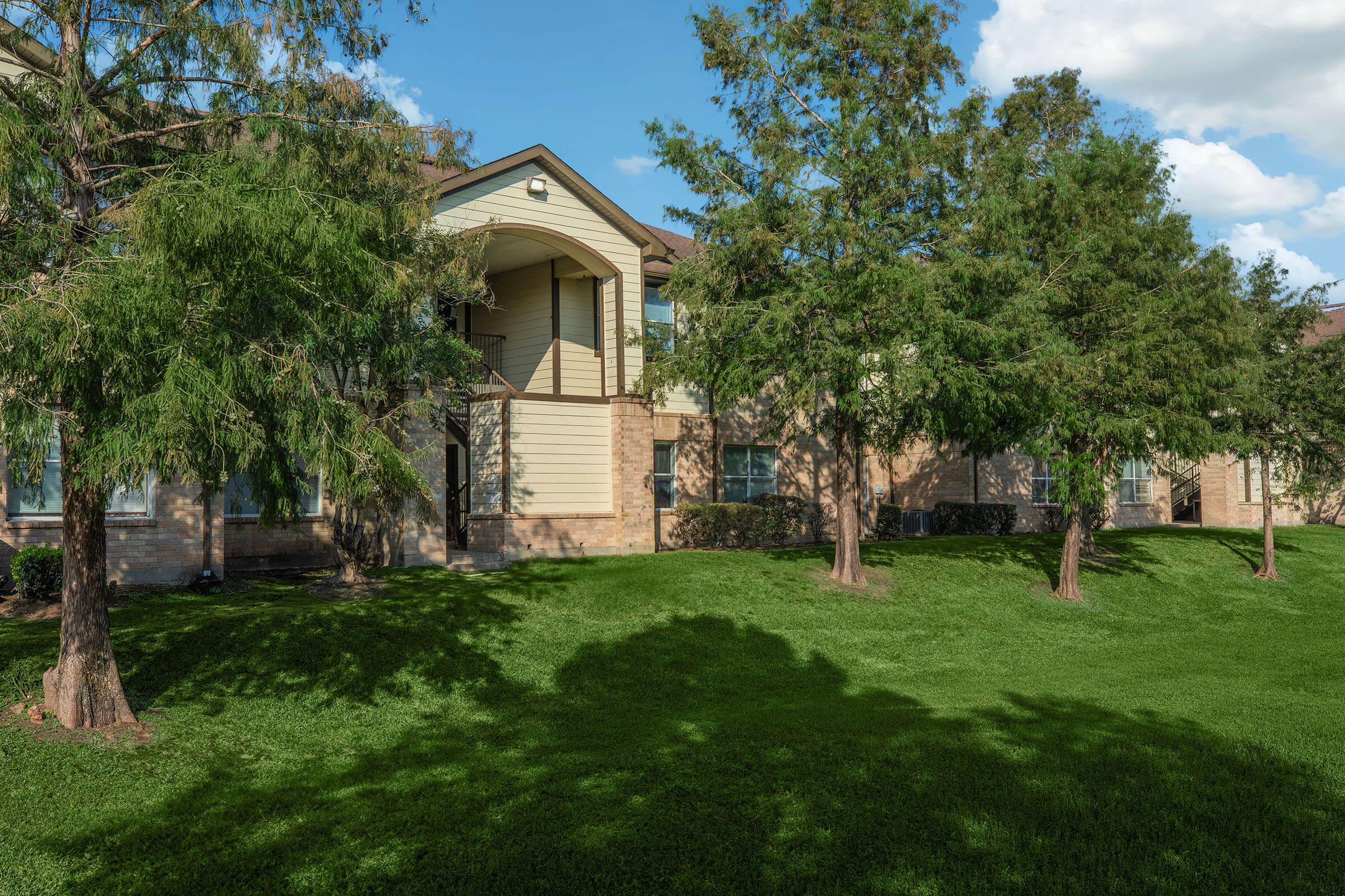 a large lawn in front of a house