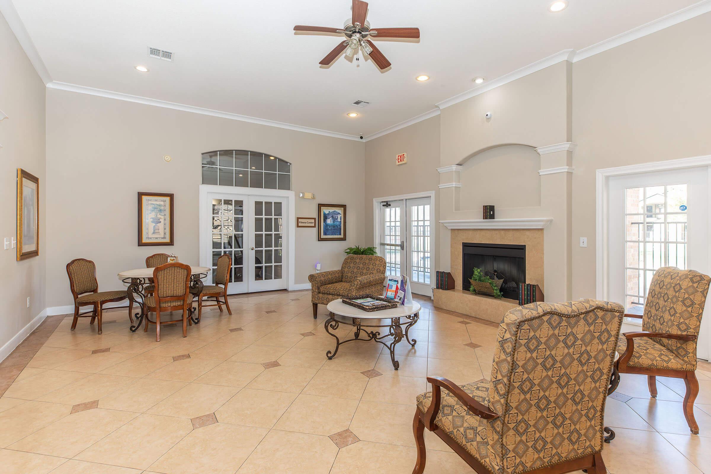 a living room filled with furniture and a fireplace