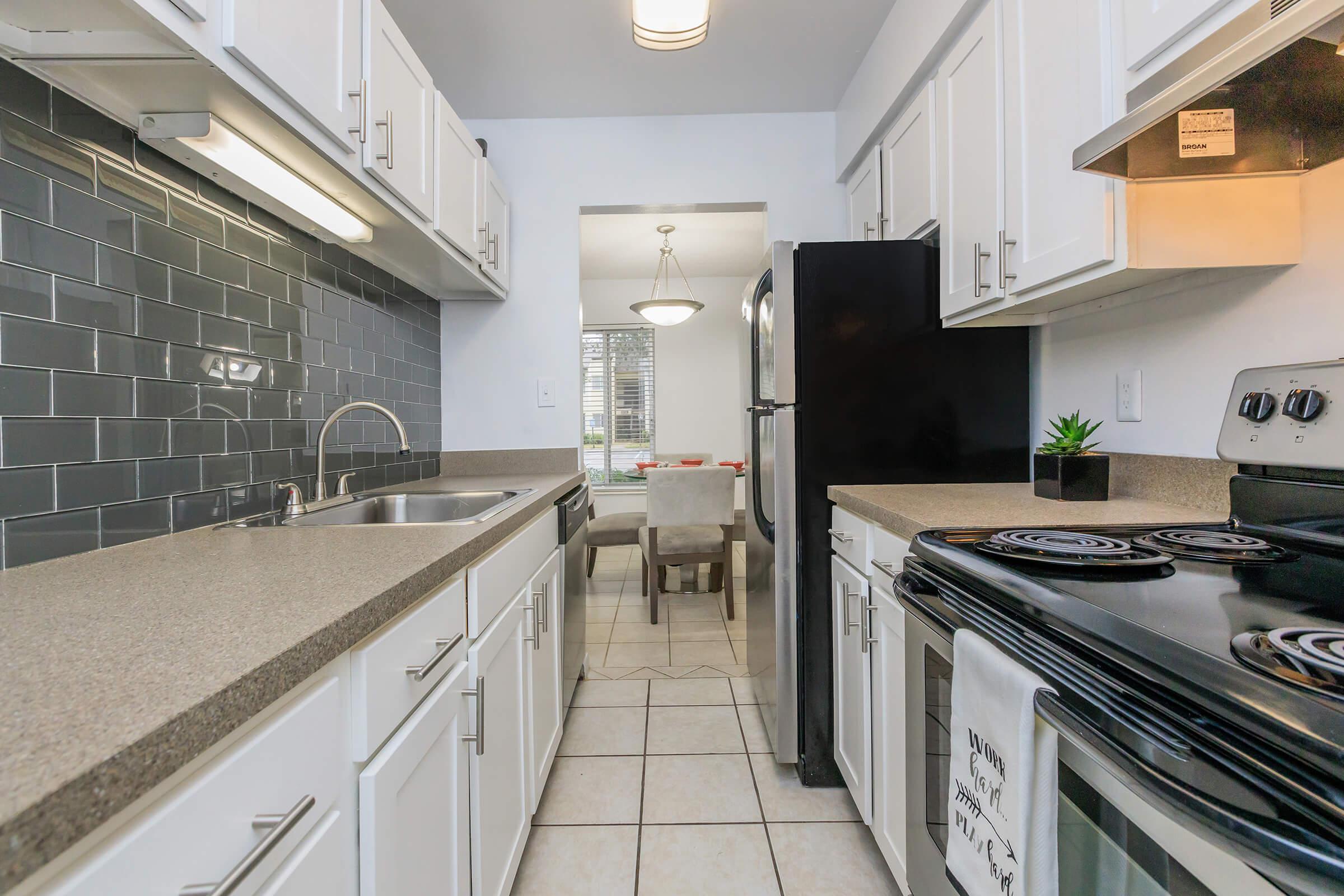 a kitchen with a stove top oven