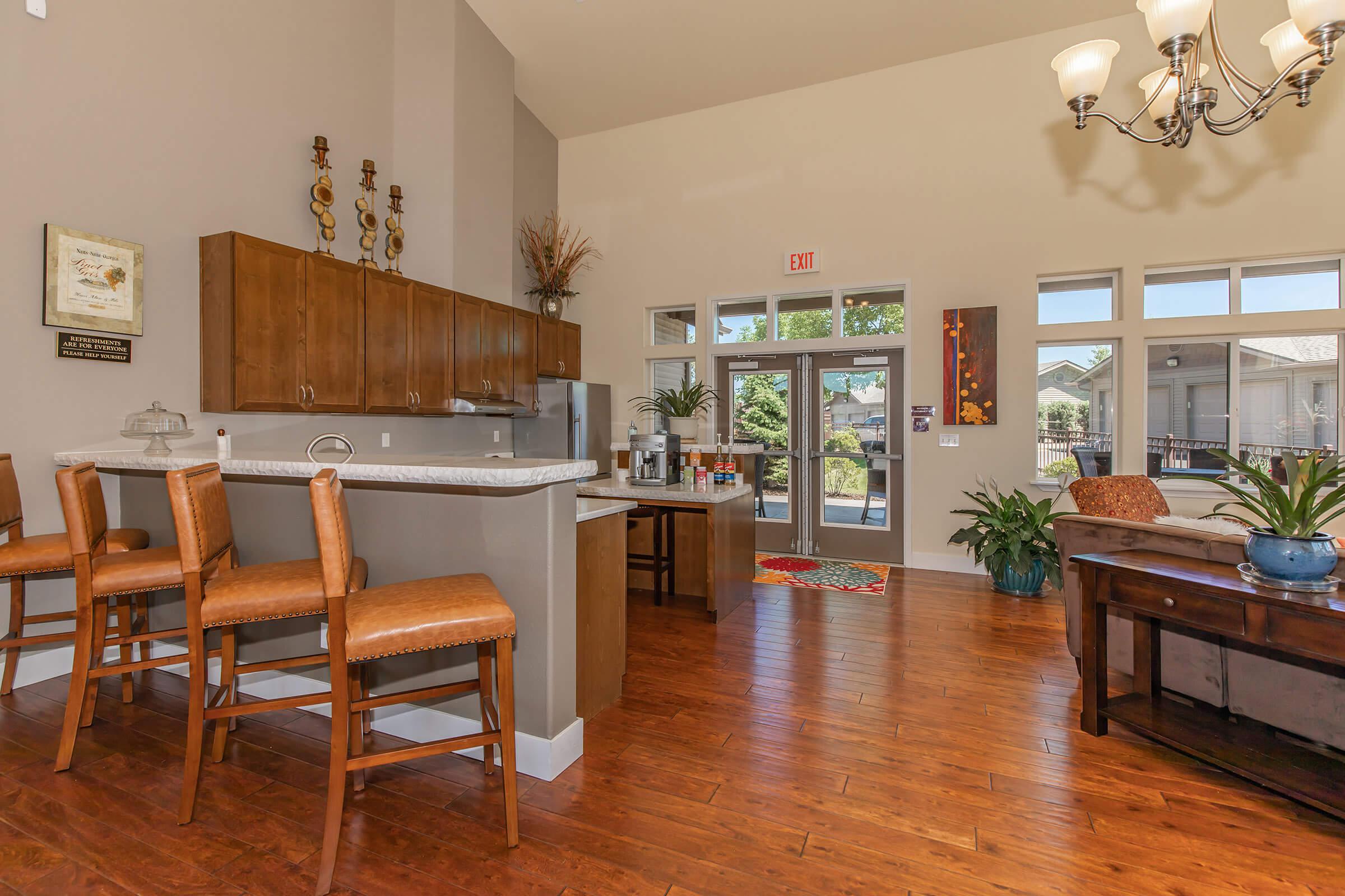a living room filled with furniture and a fire place and a dining table