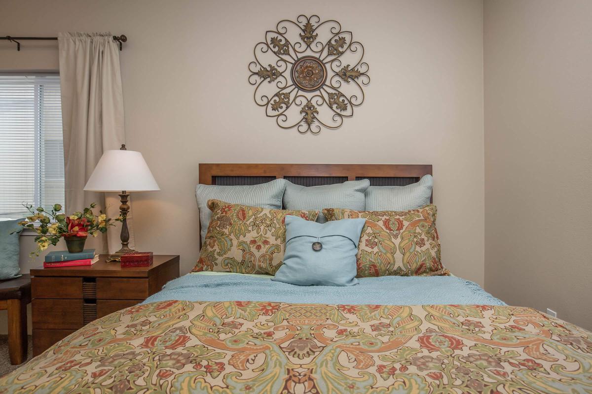 a bedroom with a bed in a room