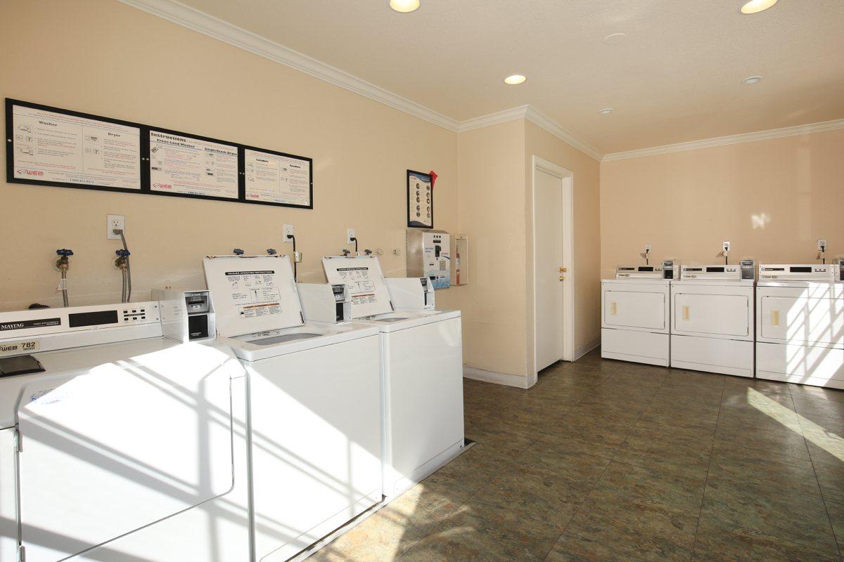 a large white refrigerator in a kitchen