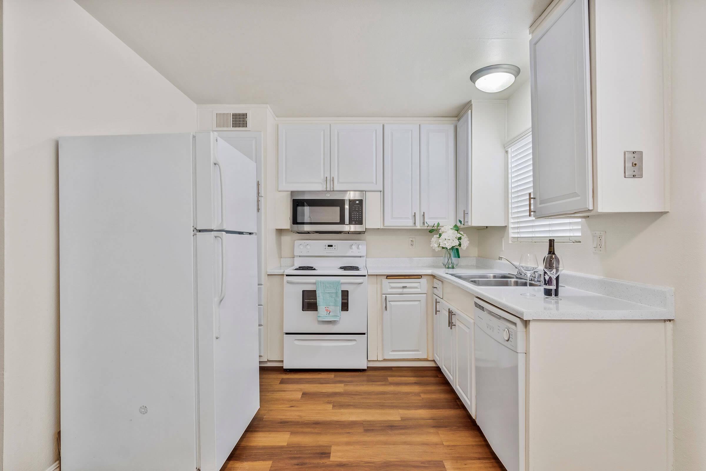 a kitchen with a stove and a refrigerator