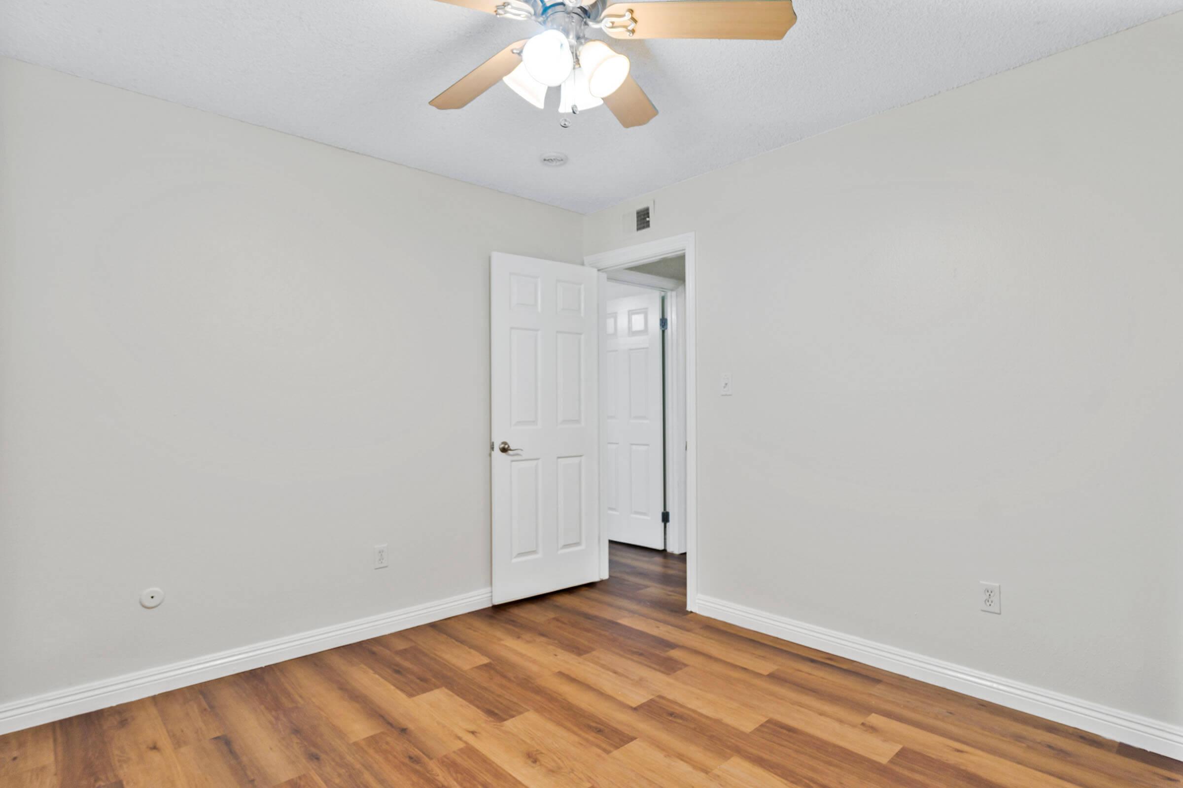 a kitchen with a wood floor