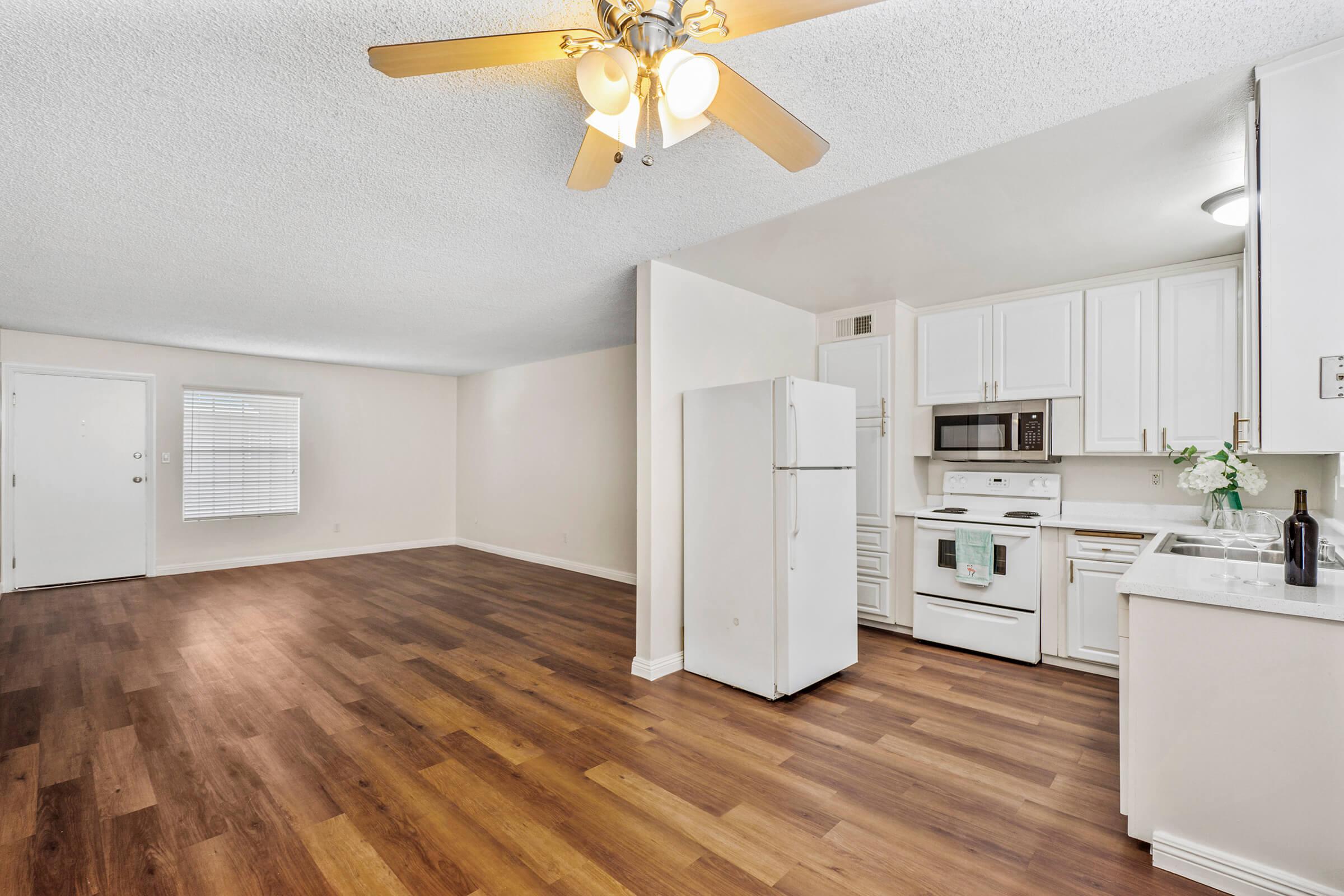 a kitchen with a wood floor