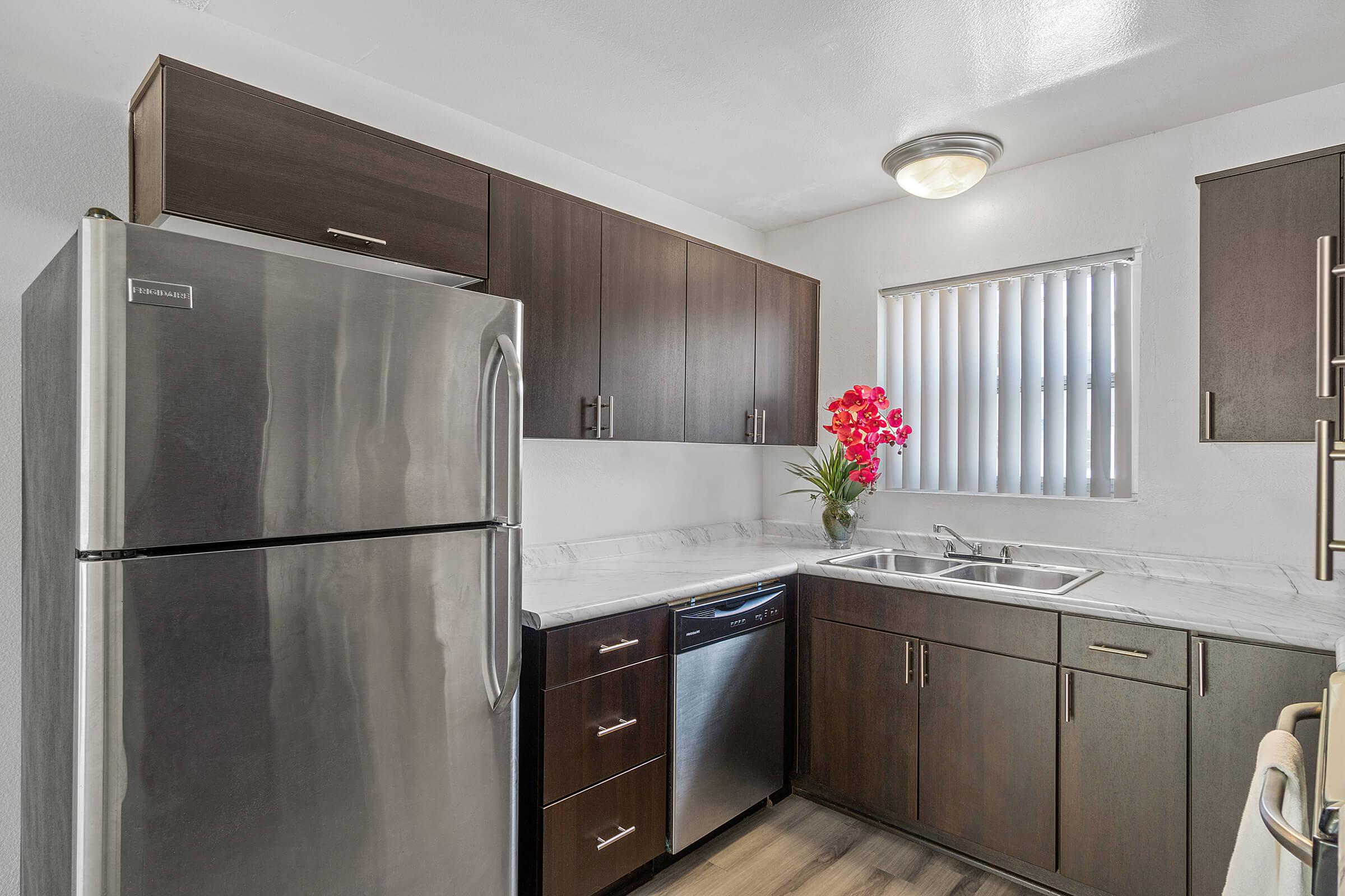 a stainless steel refrigerator in a kitchen