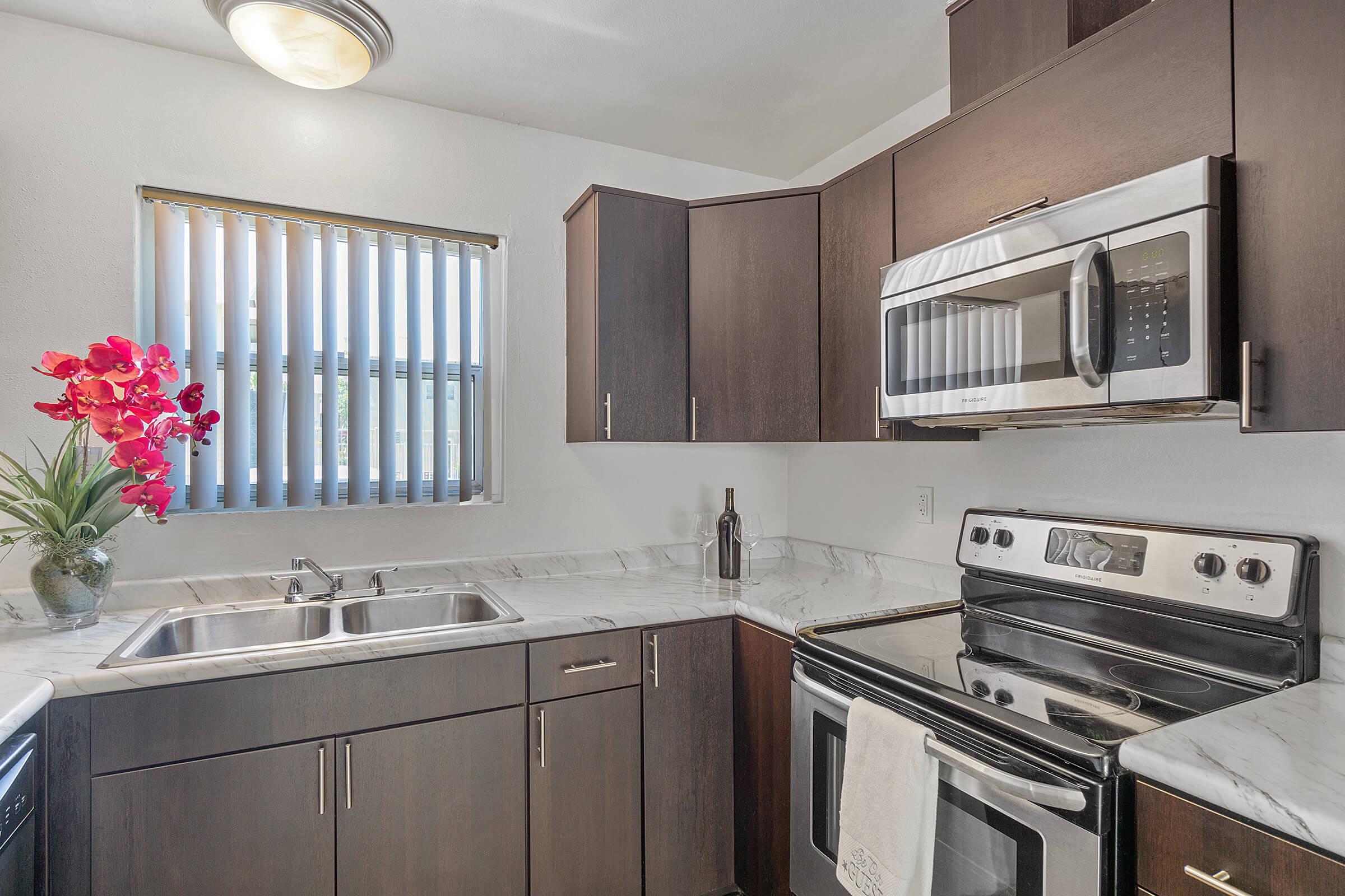 a kitchen with a sink and a window