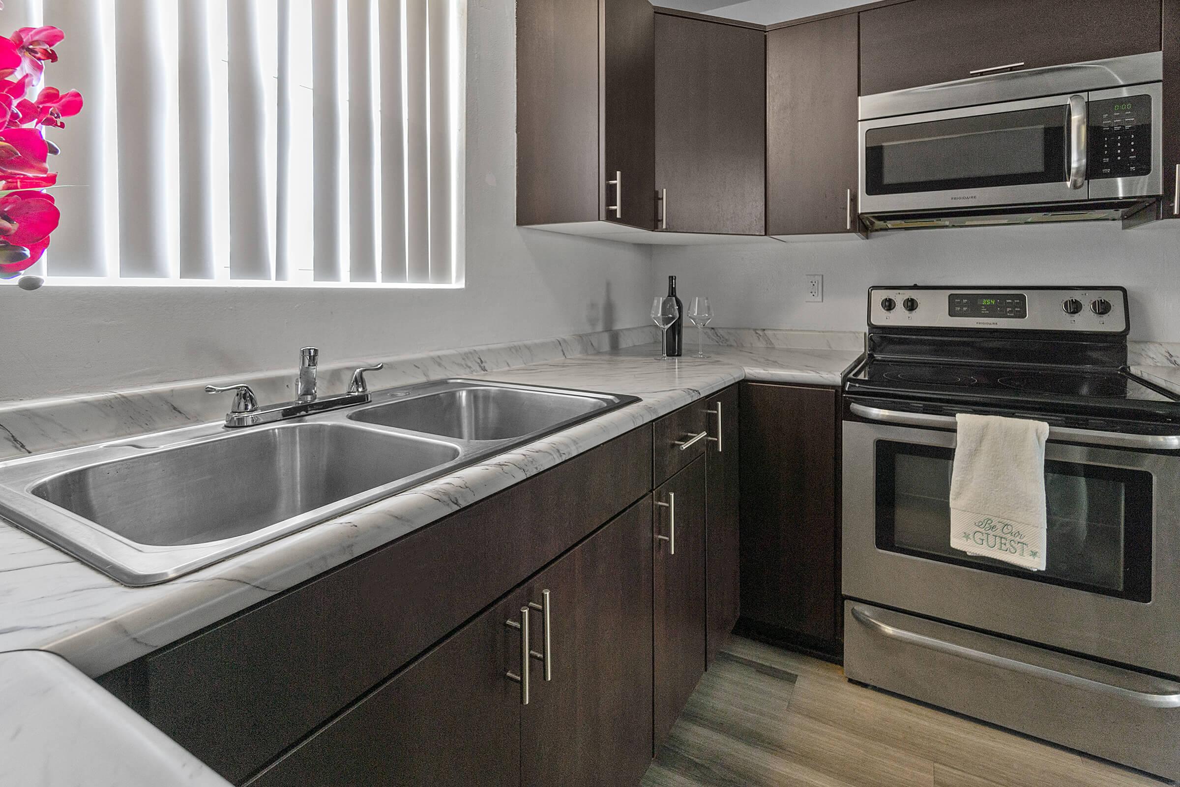 a kitchen with a sink and a window