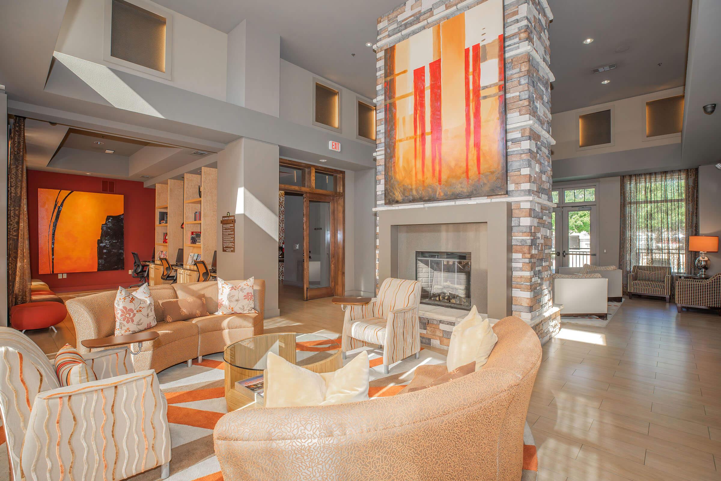 a living room filled with furniture and a fire place