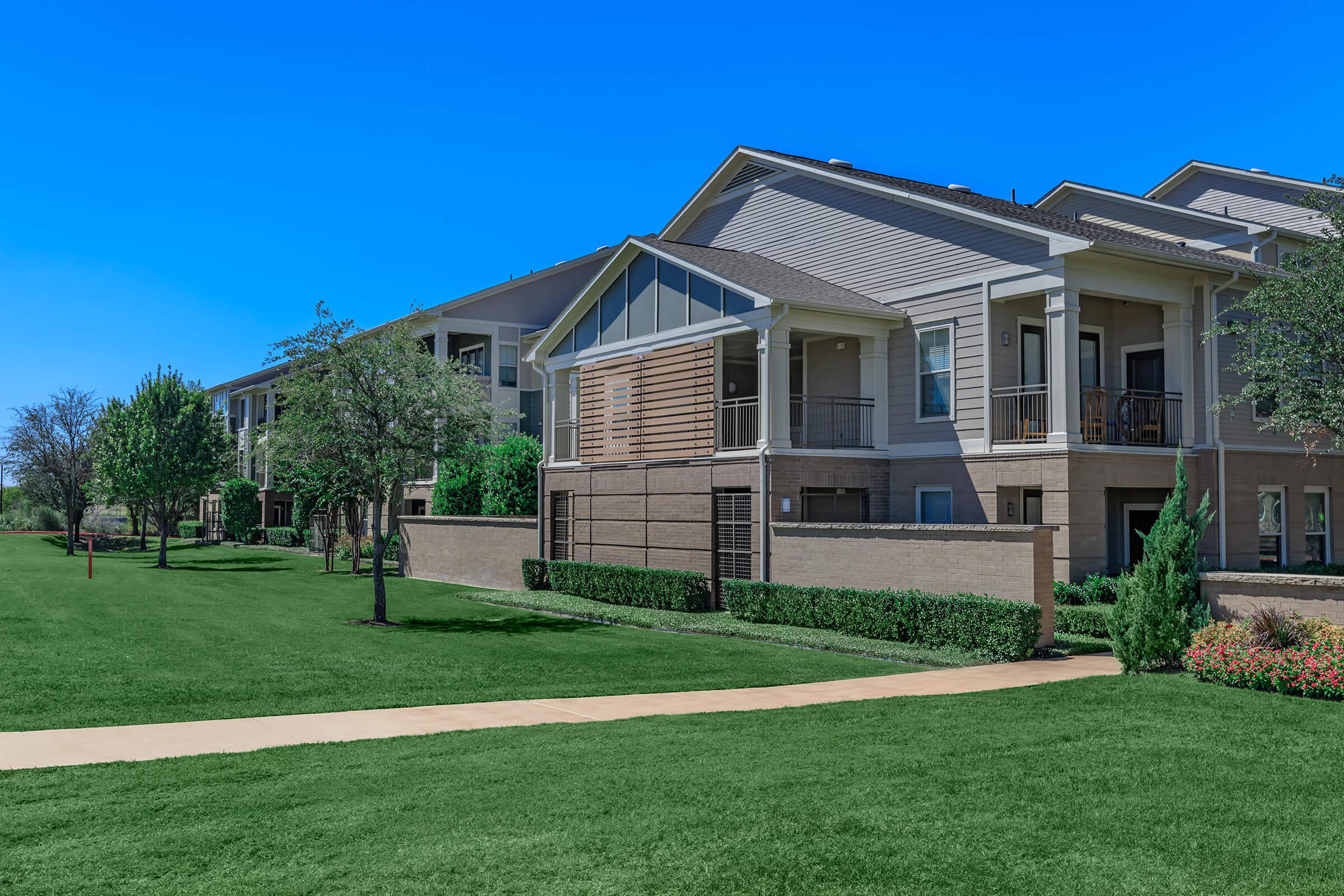 a large lawn in front of a house