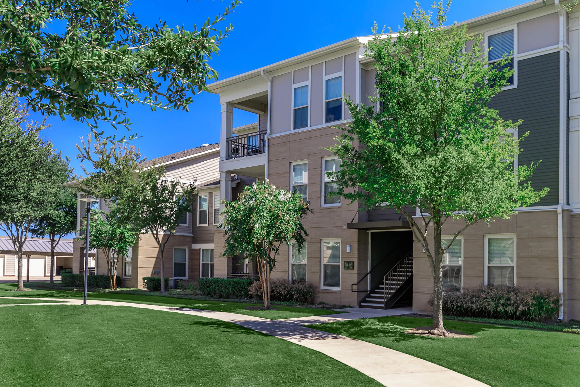 a large lawn in front of a house