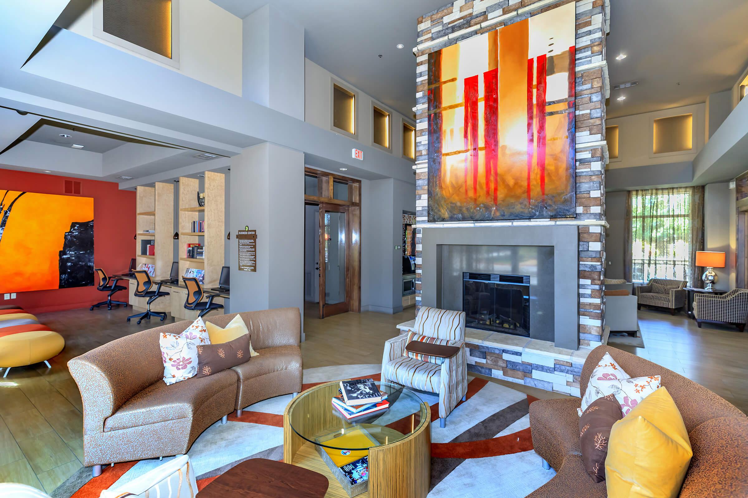 a living room filled with furniture and a fireplace