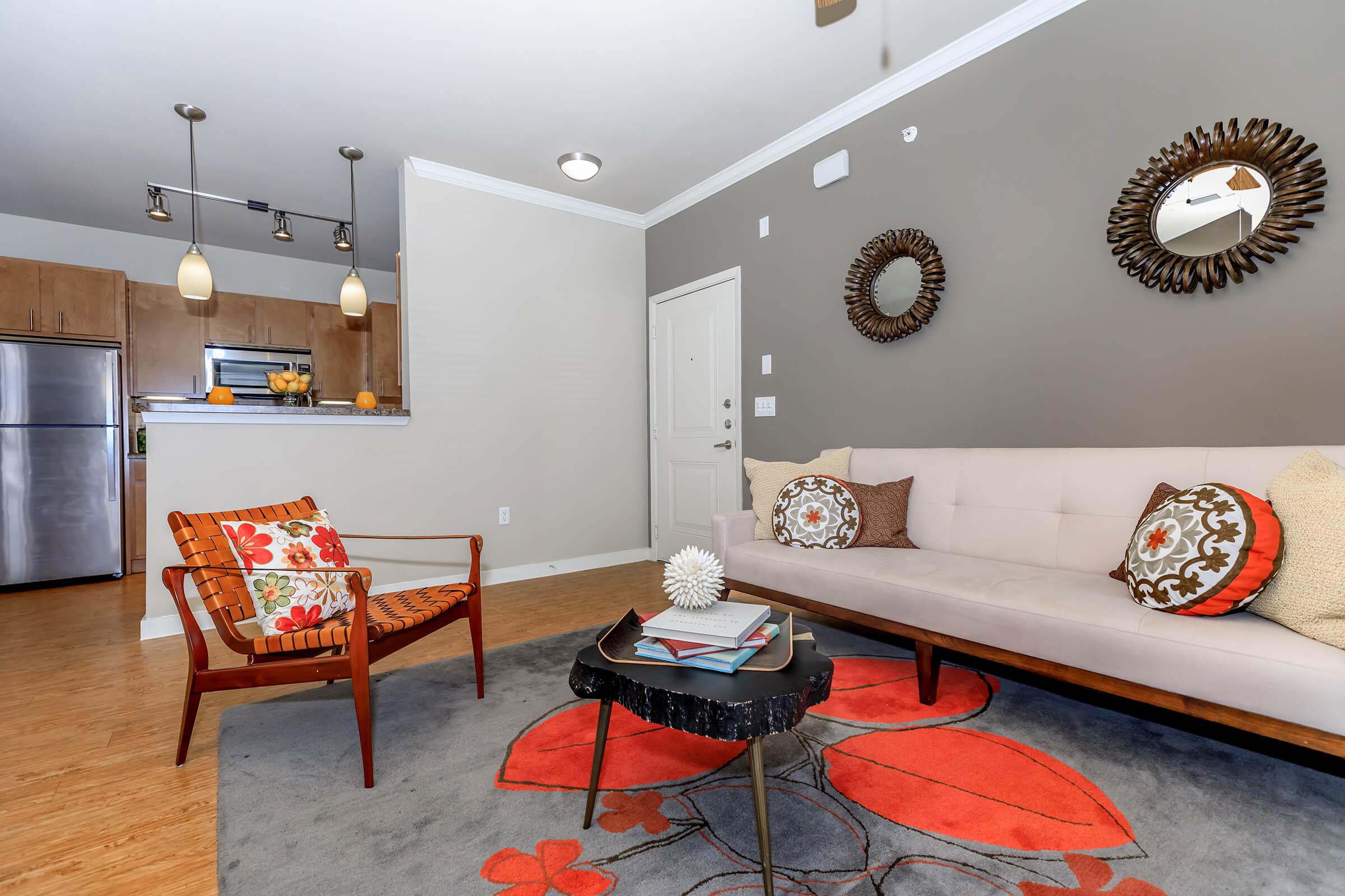 a bedroom with a bed and desk in a room