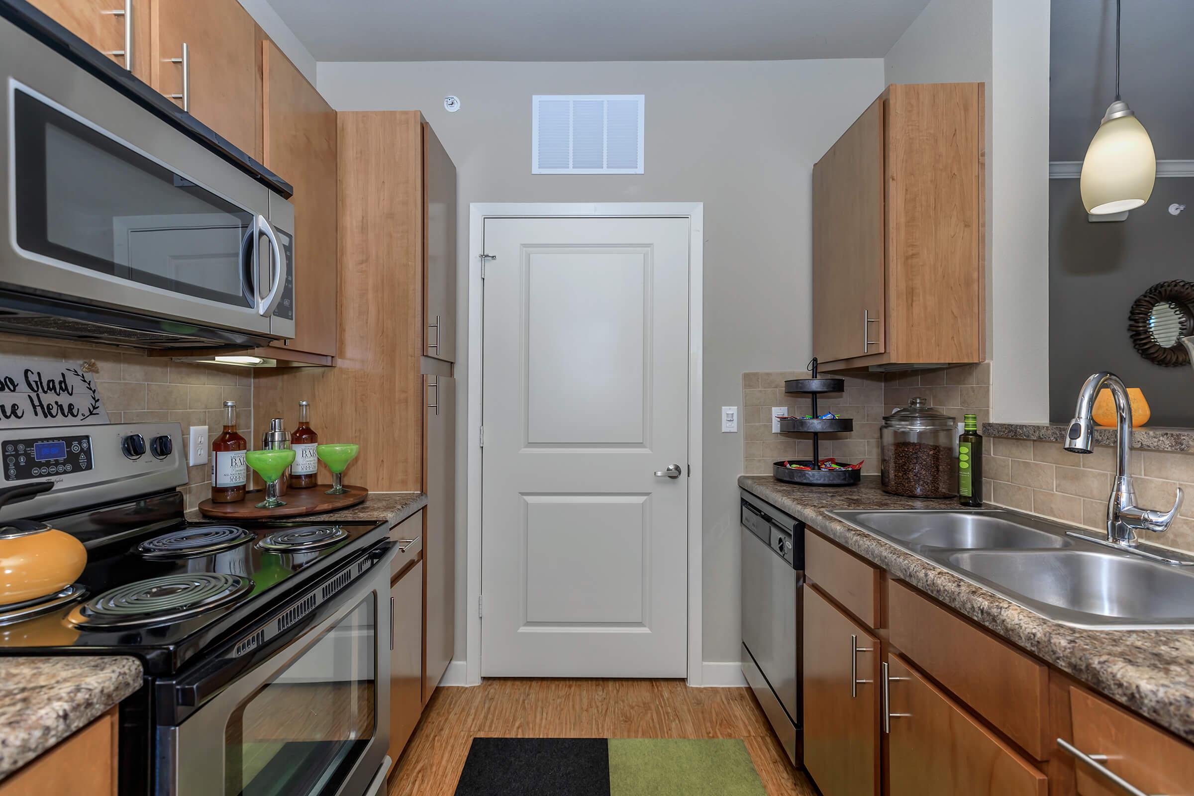 a modern kitchen with stainless steel appliances