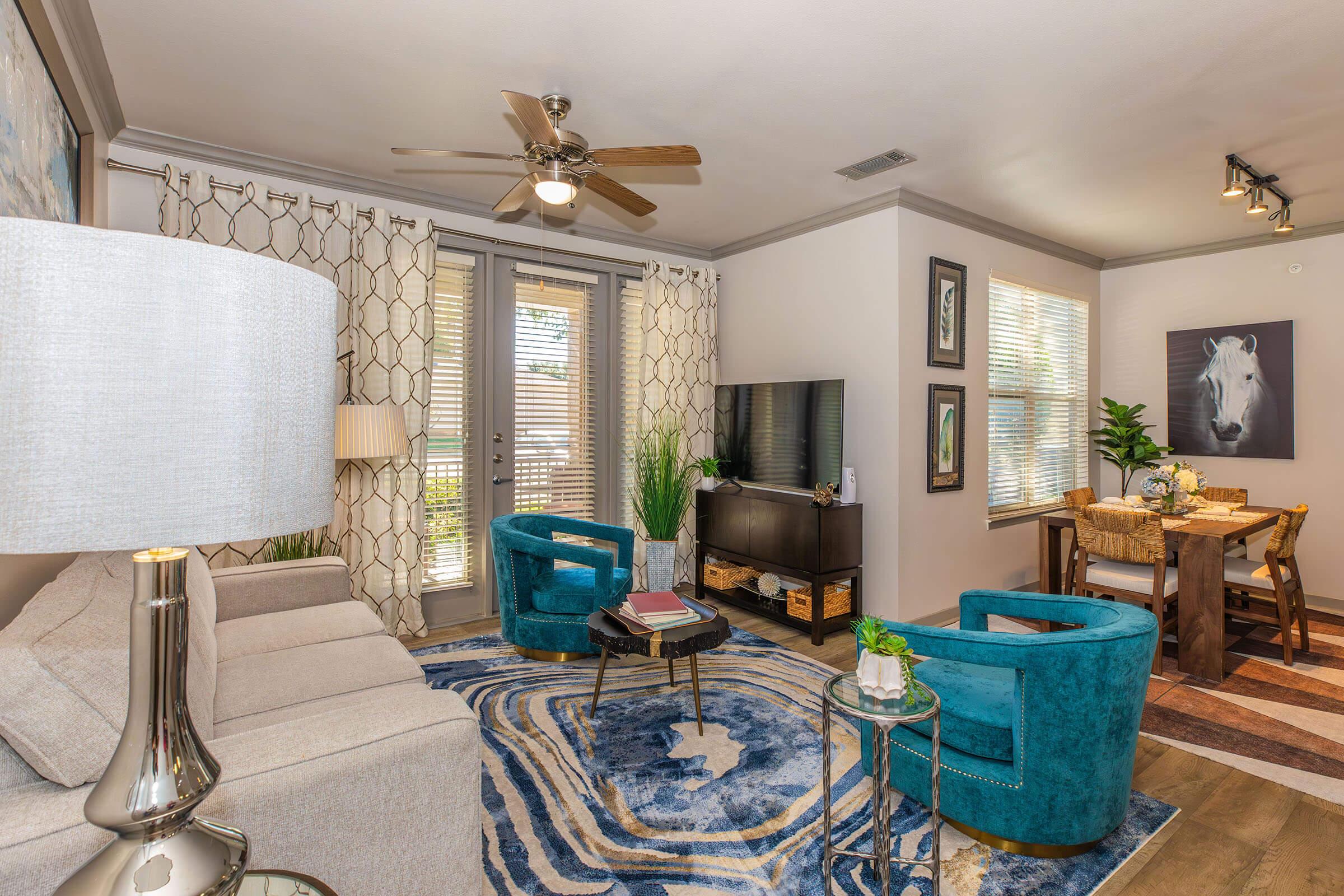 a living room filled with furniture and a fireplace