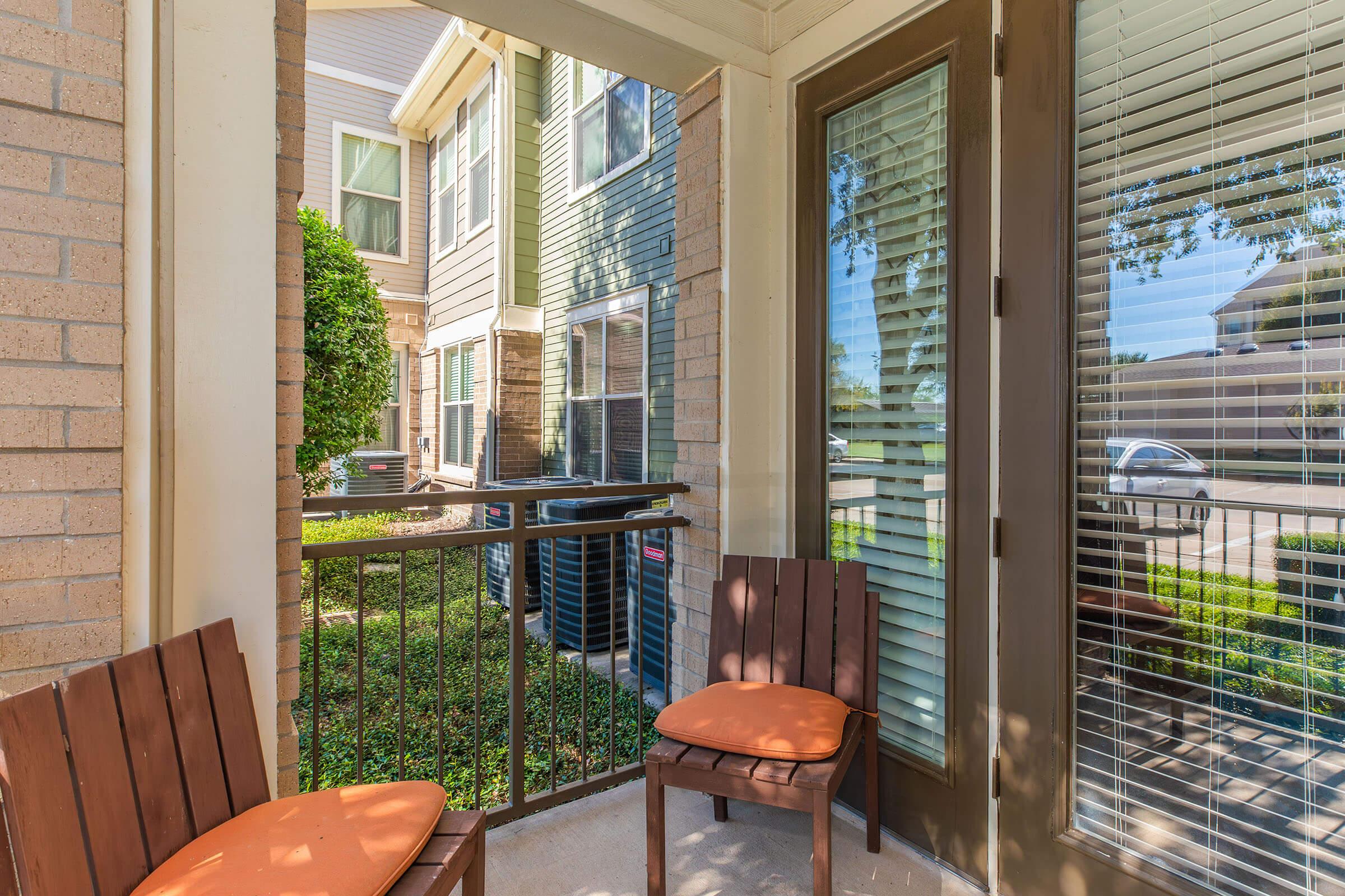 a chair sitting in front of a window