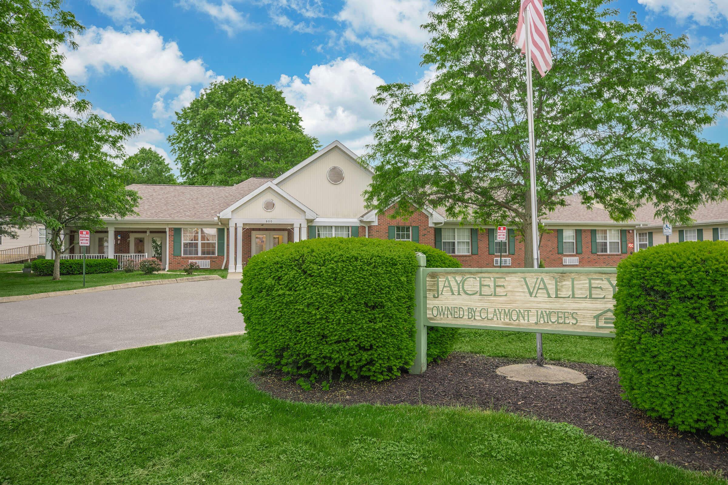 a green lawn in front of a house