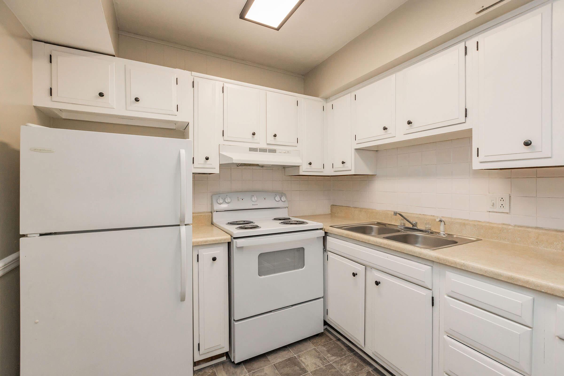 a kitchen with a stove top oven sitting inside of a refrigerator